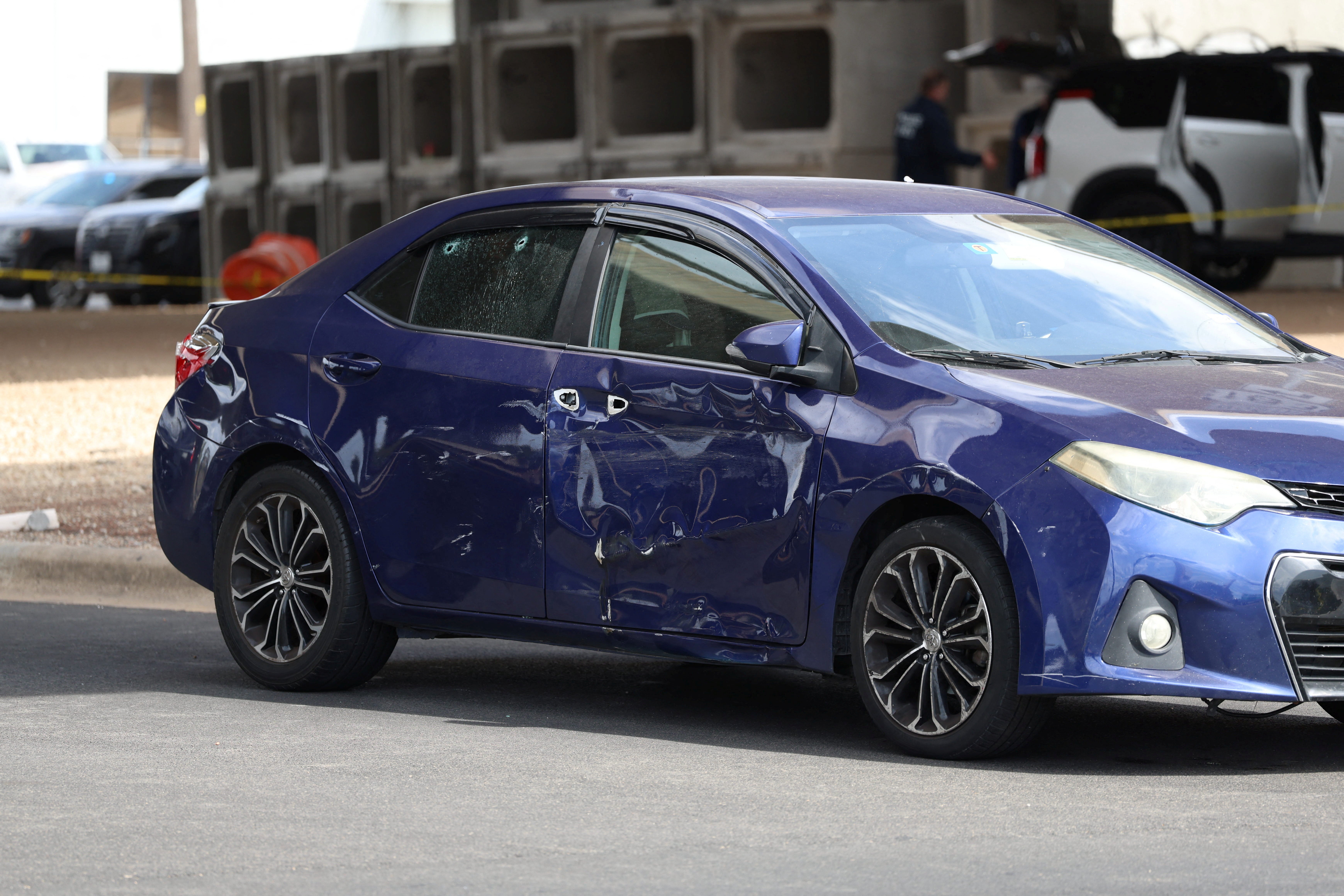 A damaged car after a US Immigration and Customs Enforcement (ICE) agent shot a person earlier in the day in Austin