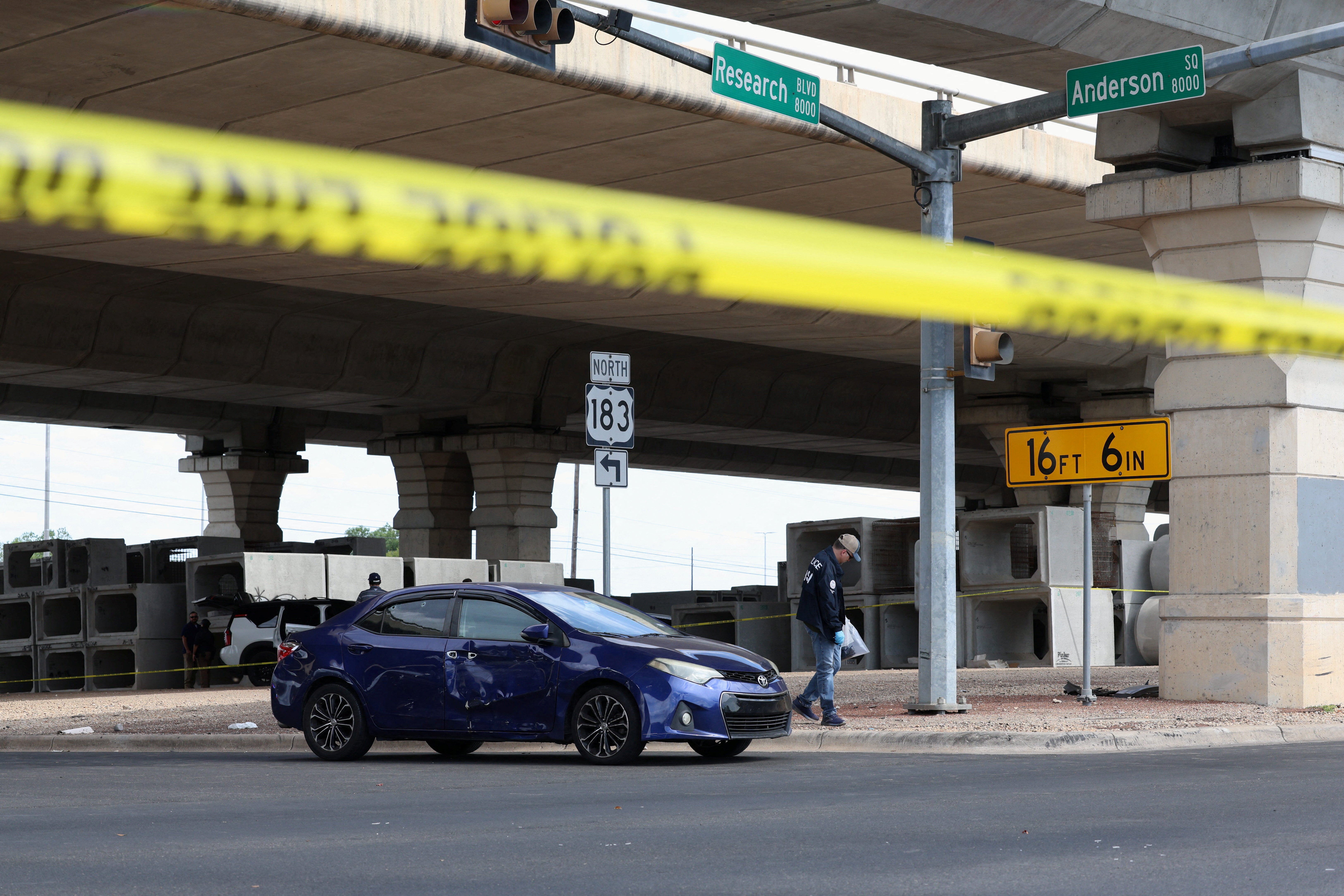 A car at the scene appeared to have bullet holes in it