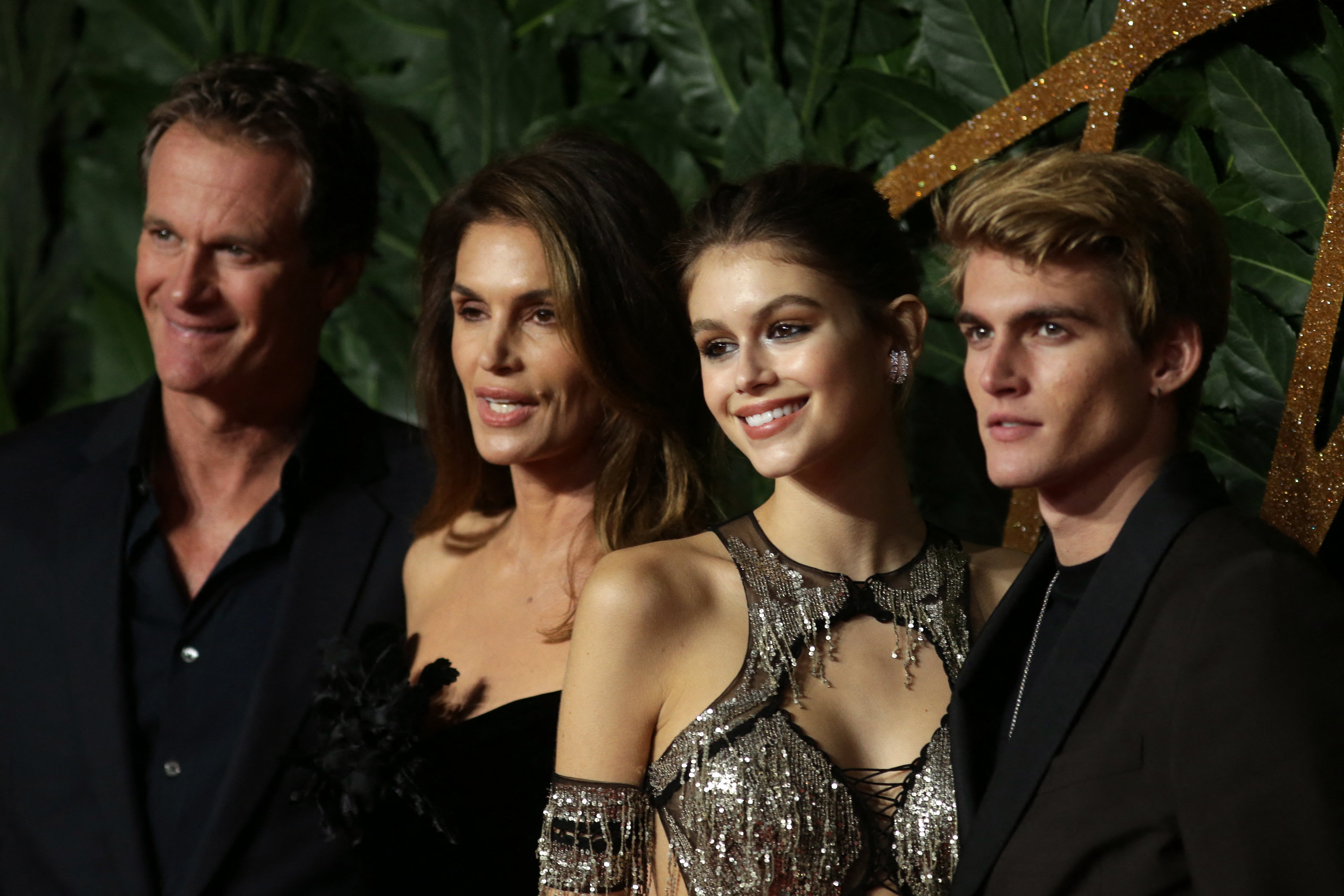 US model Cindy Crawford (2nd L), her husband Rande Gerber (L), daughter, US model Kaia Jordan Gerber (2nd R) and son, Presley Gerber (R) attend the British Fashion Awards 2018