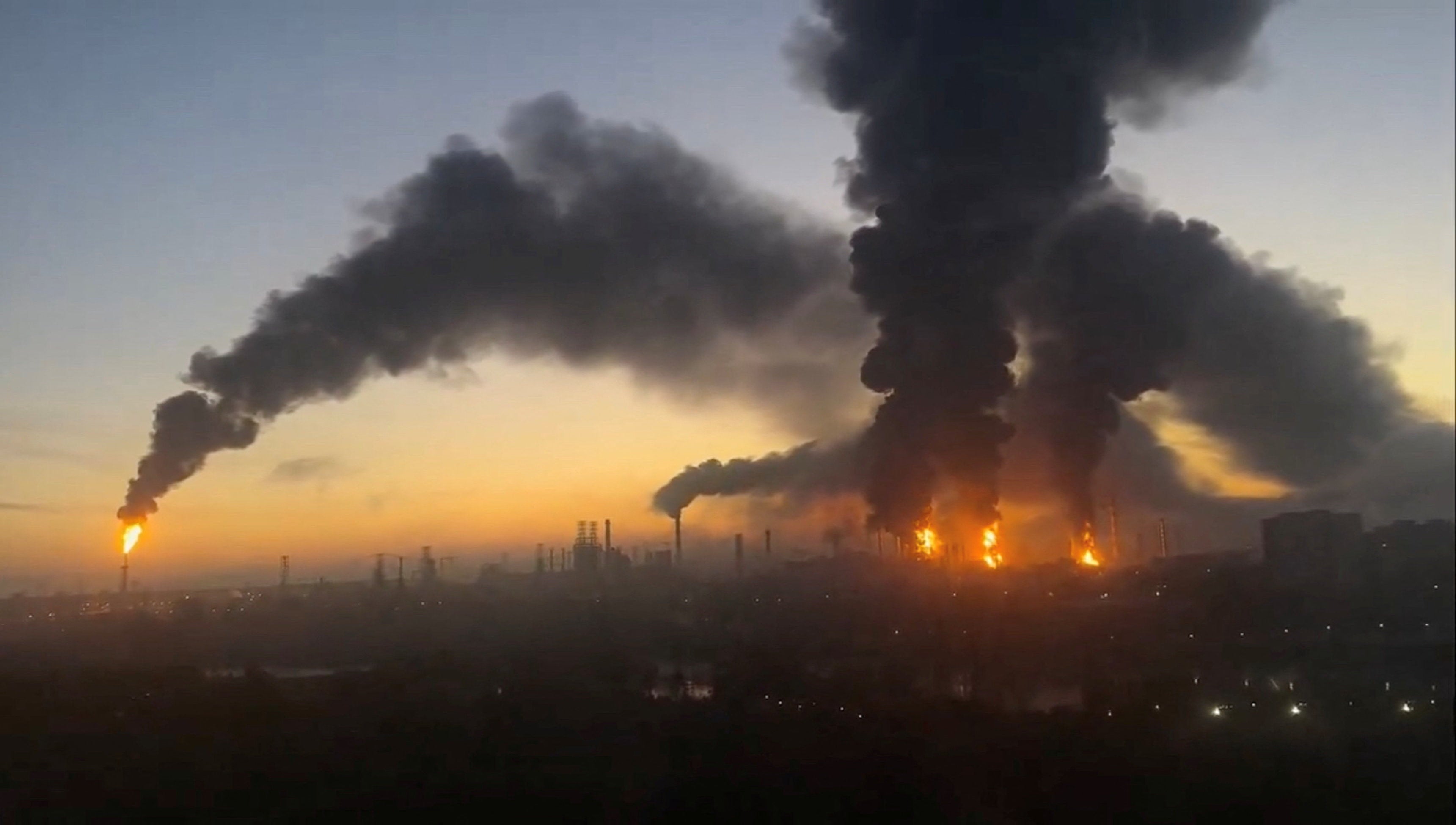 Smoke columns rise after strikes in an oil refinery in Moscow, September 20, 2026
