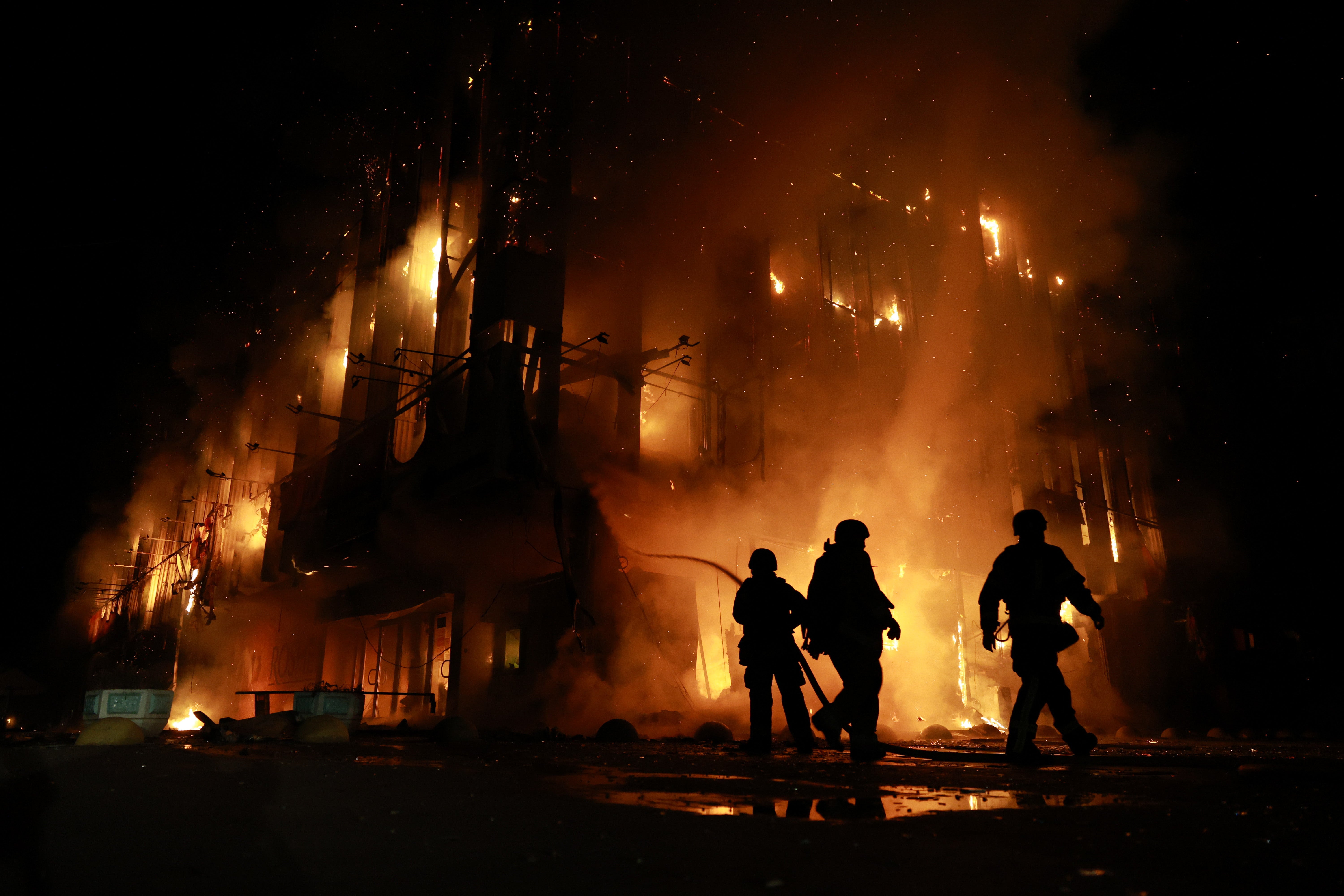 Rescue workers put out a fire at the Intrade trade centre (AP)