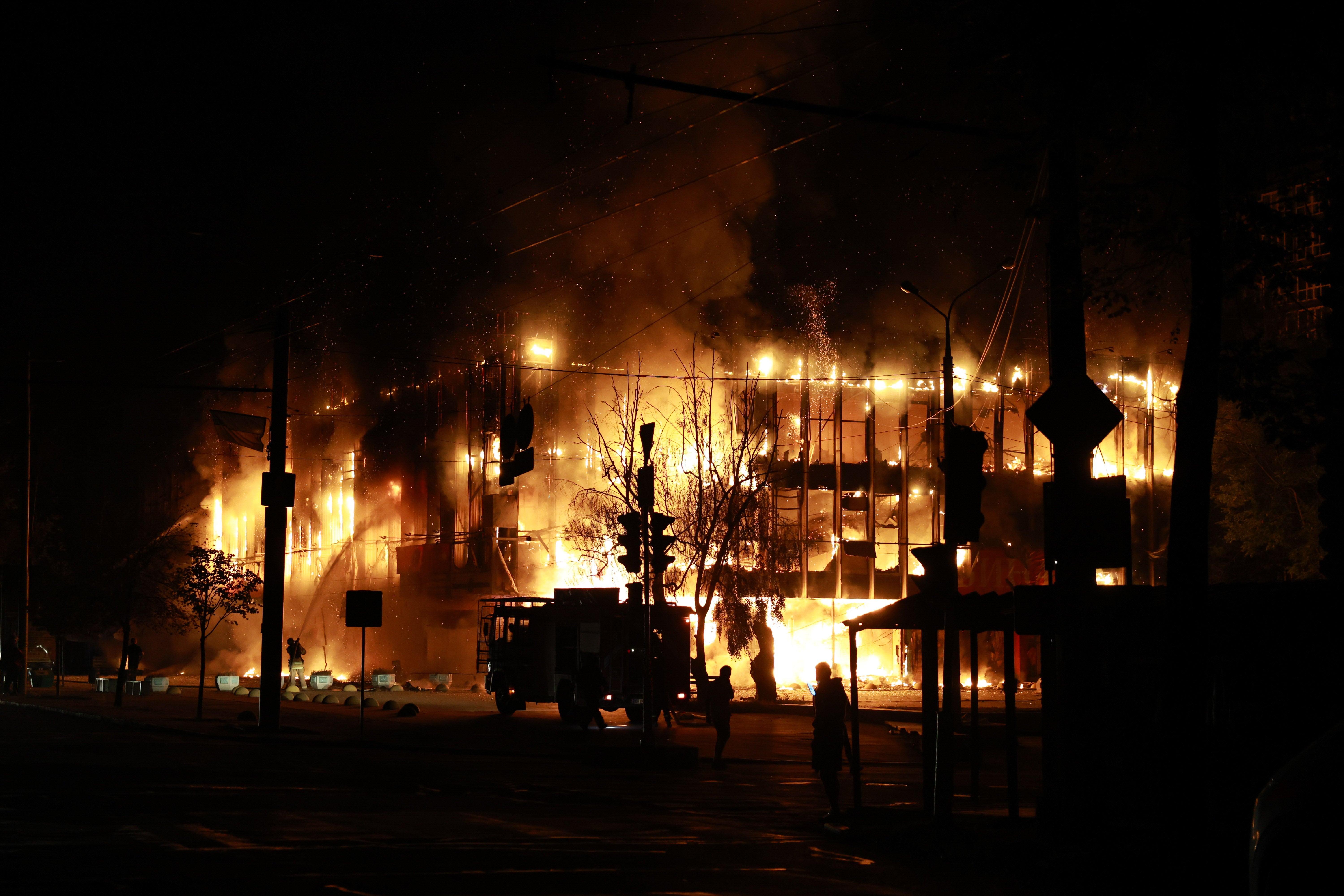 Rescue workers put out a fire at the Intrade trade centre after a Russian drone strike on Zaporizhzhia, Ukraine, Monday, Sept. 21, 2026 (AP)