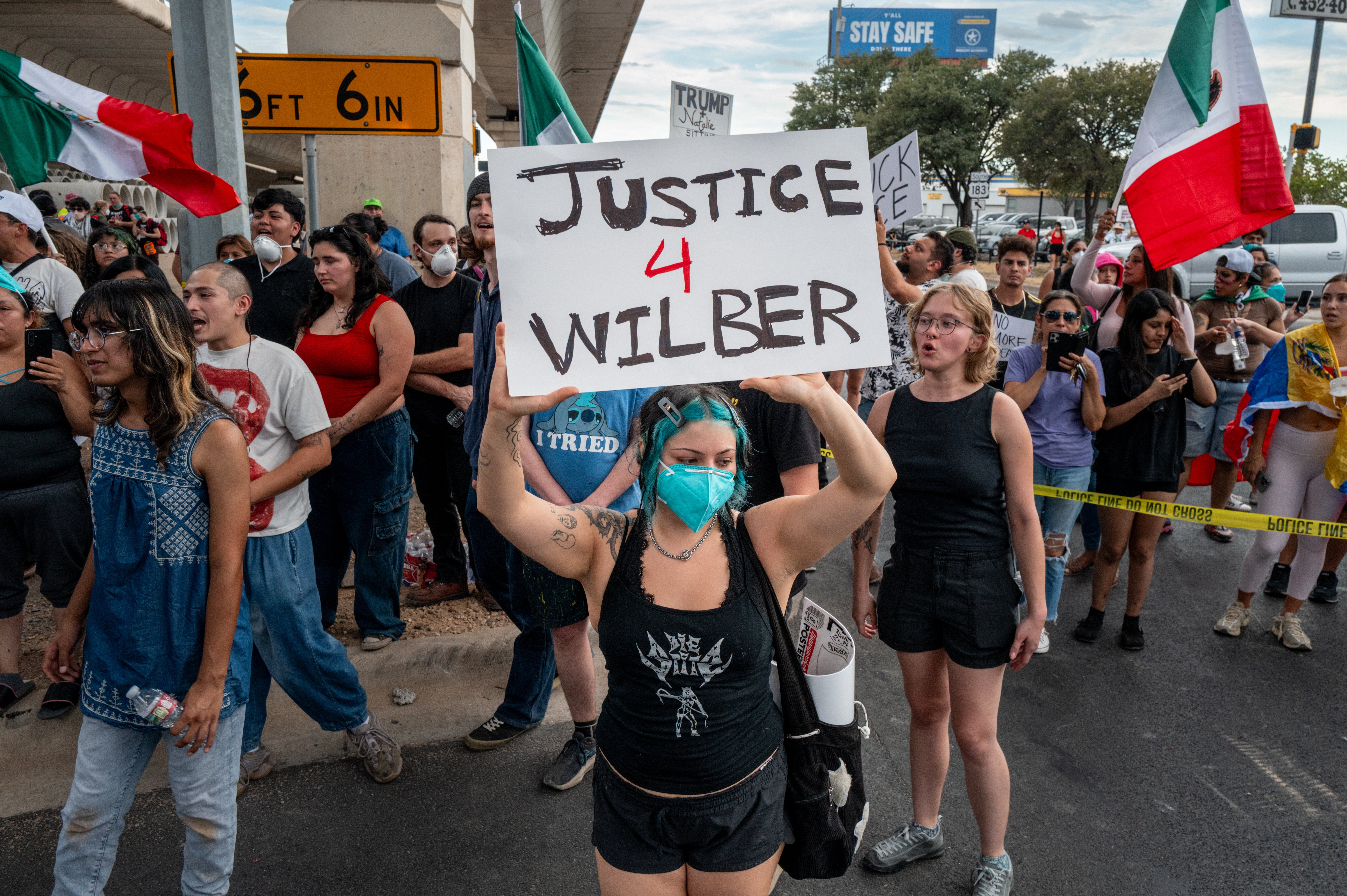 People protest against Immigration and Customs Enforcement (ICE) officers Sunday