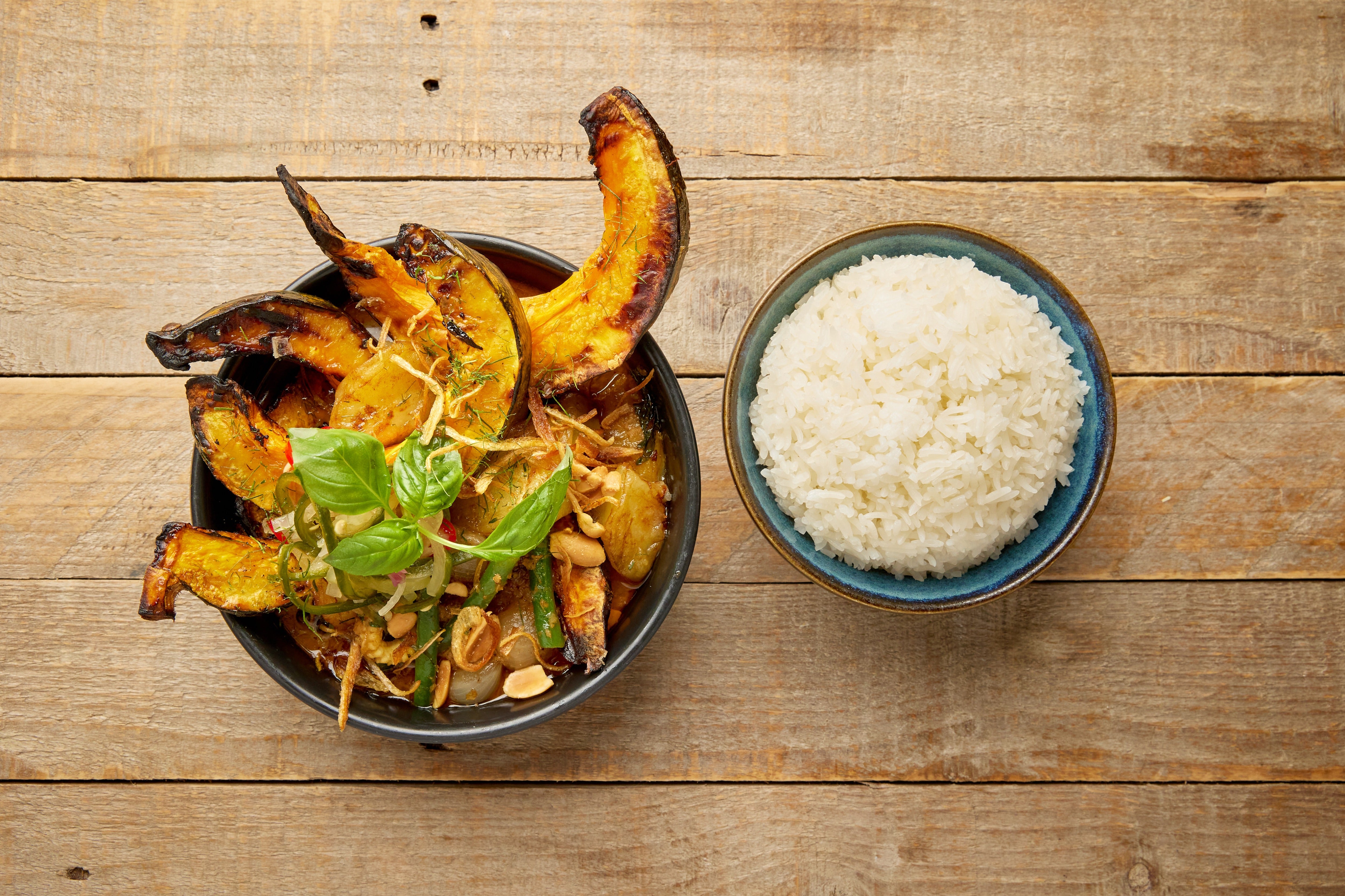 Roast pumpkin and caramelised apple bring autumn sweetness to a rich massaman curry with coconut, basil and peanuts
