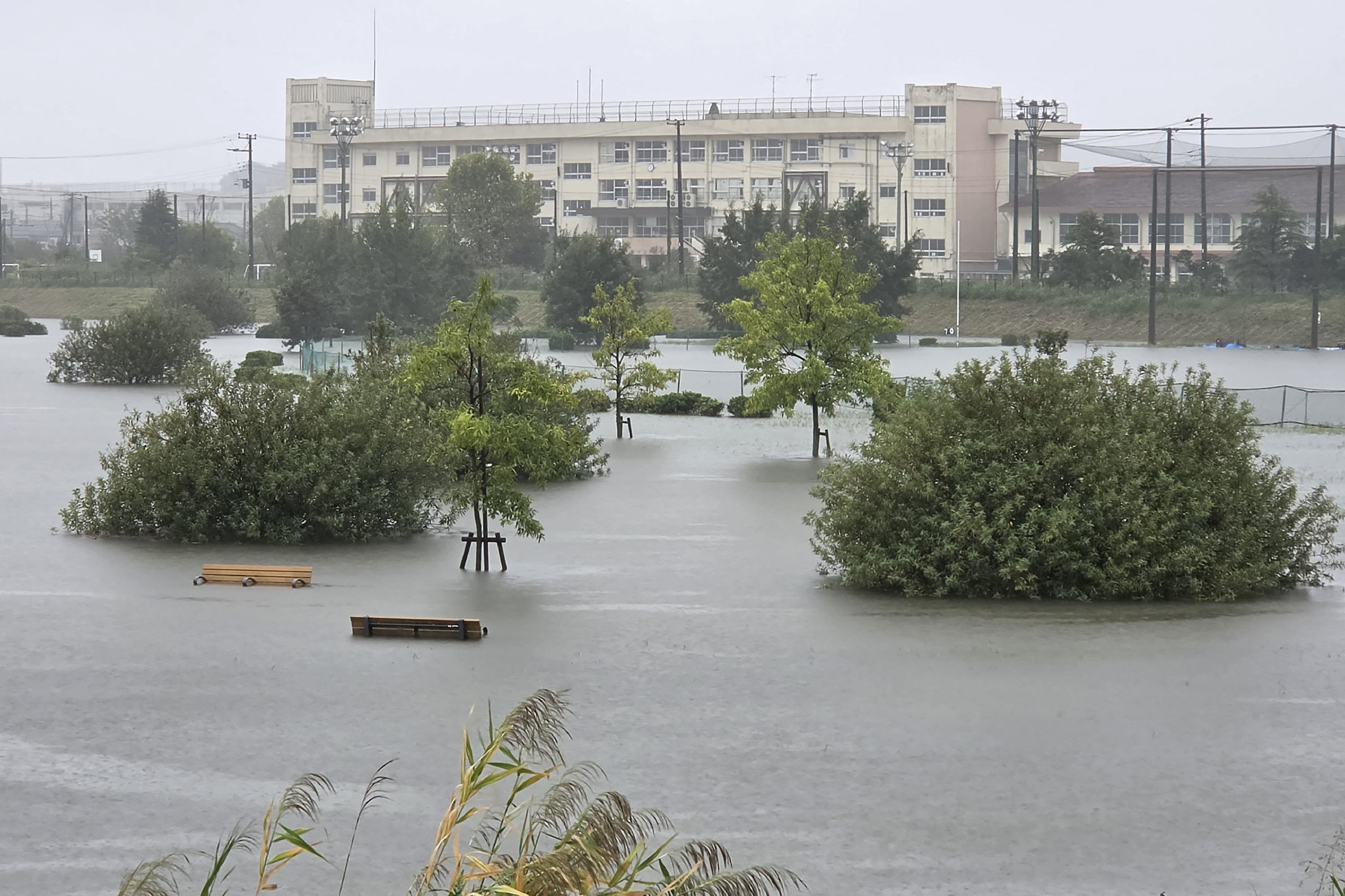 Flooding inundates a park as heavy rain falls due to Typhoon Dujuan in Ichikawa city, Chiba prefecture