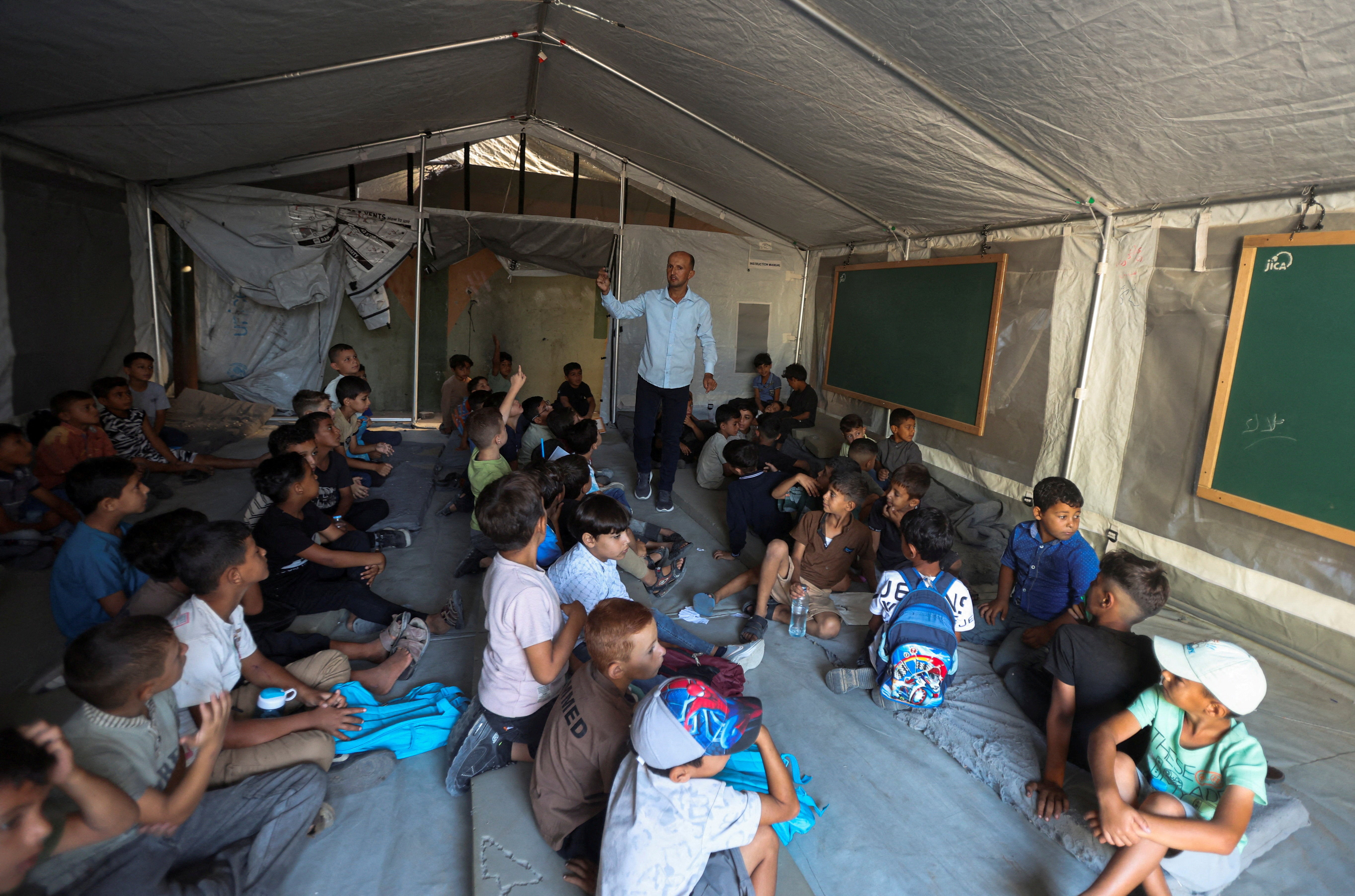 Palestinian students attend their first day of the new school year inside a tent classroom at a school in Khan Younis, in the southern Gaza Strip, September 19, 2026