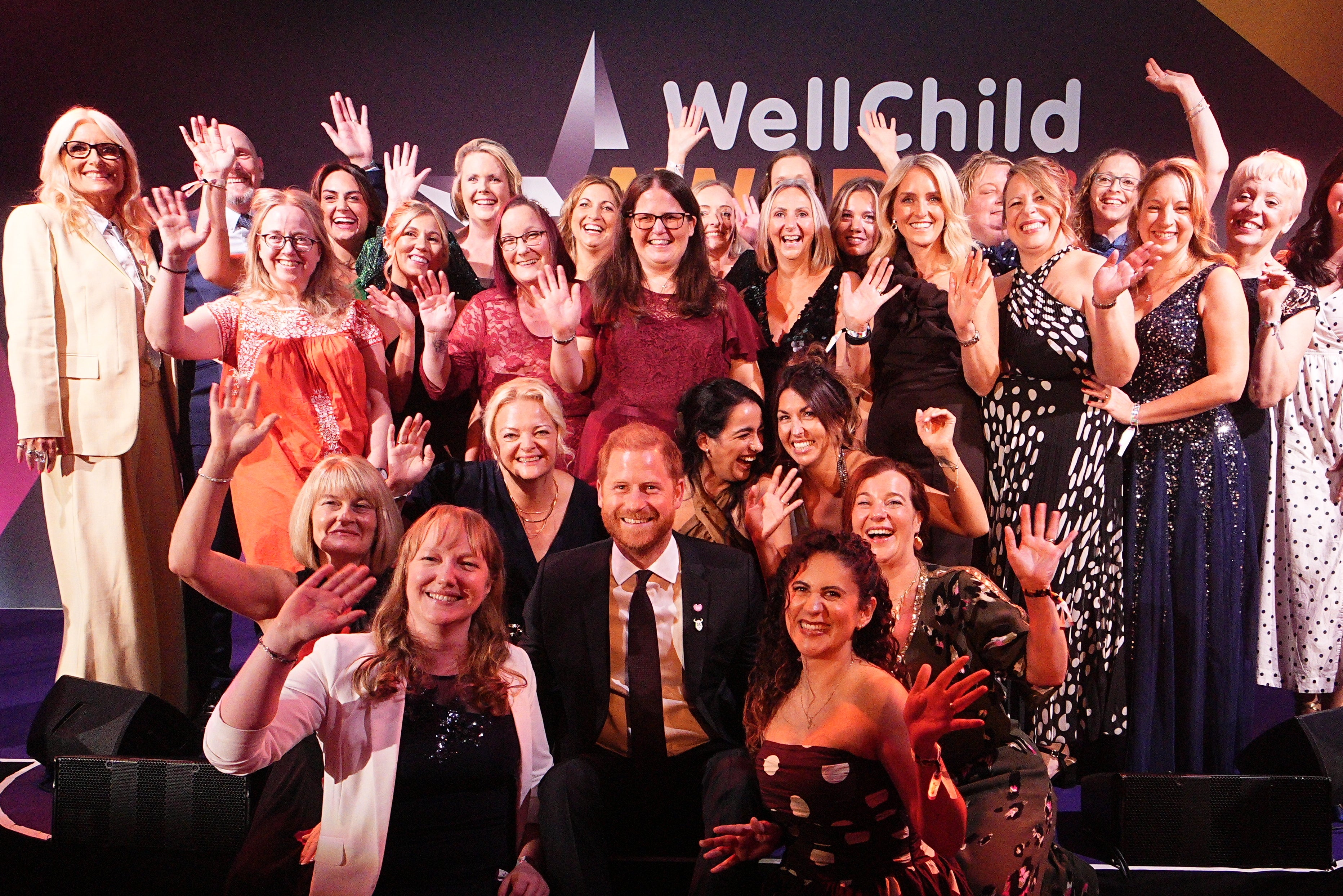 Harry with WellChild nurses (Aaron Chown/PA)