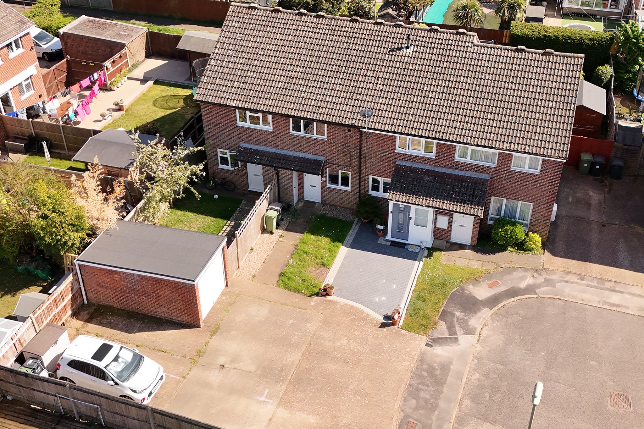 Sally Beaney's home (blue/grey front door), driveway and neighbouring driveways