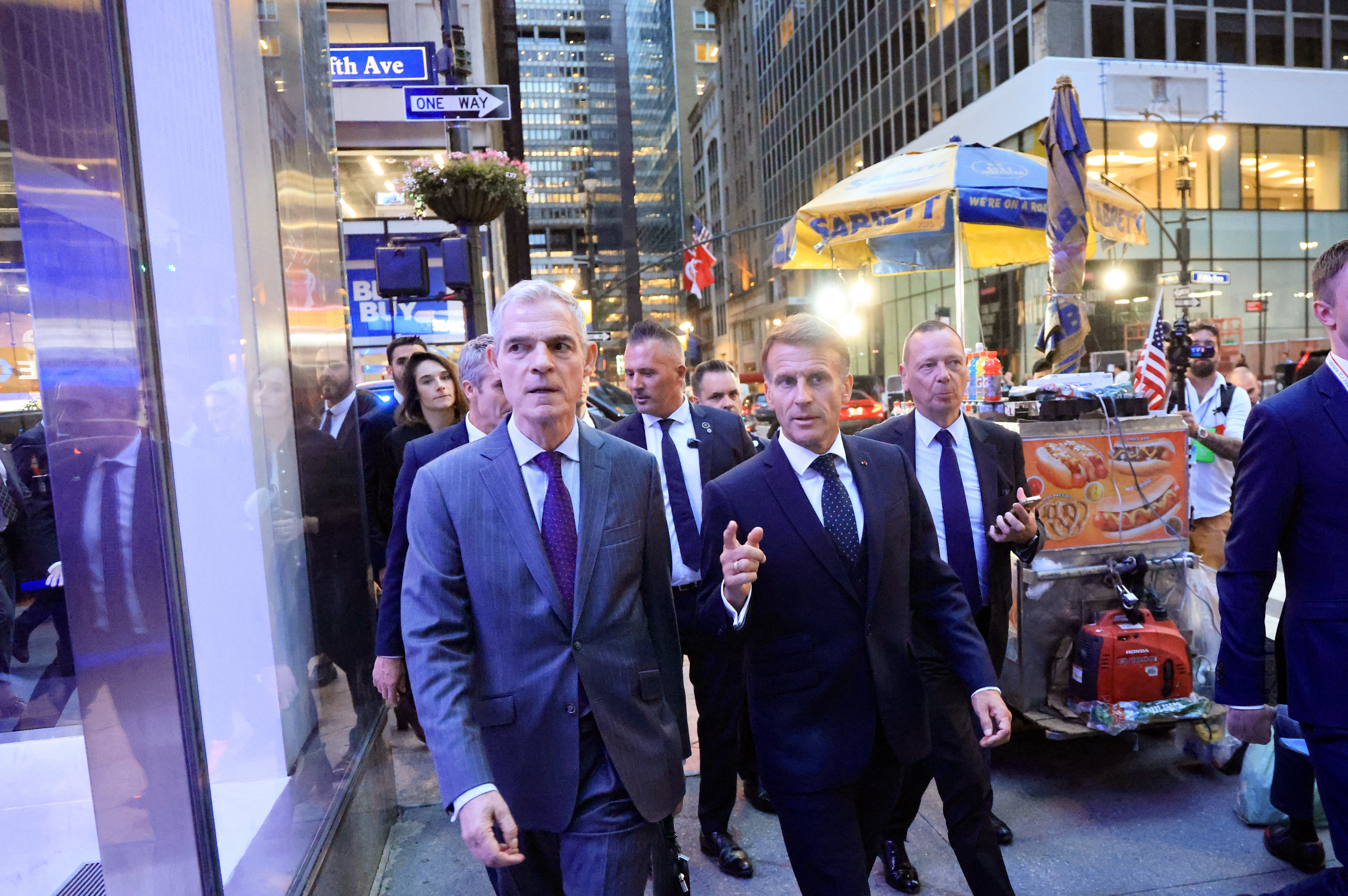 President Emmanuel Macron (R) walks with Jerome Bonnafont (L), Permanent Representative of France to the United Nations after a meeting with US President Donald Trump at Trump Tower i