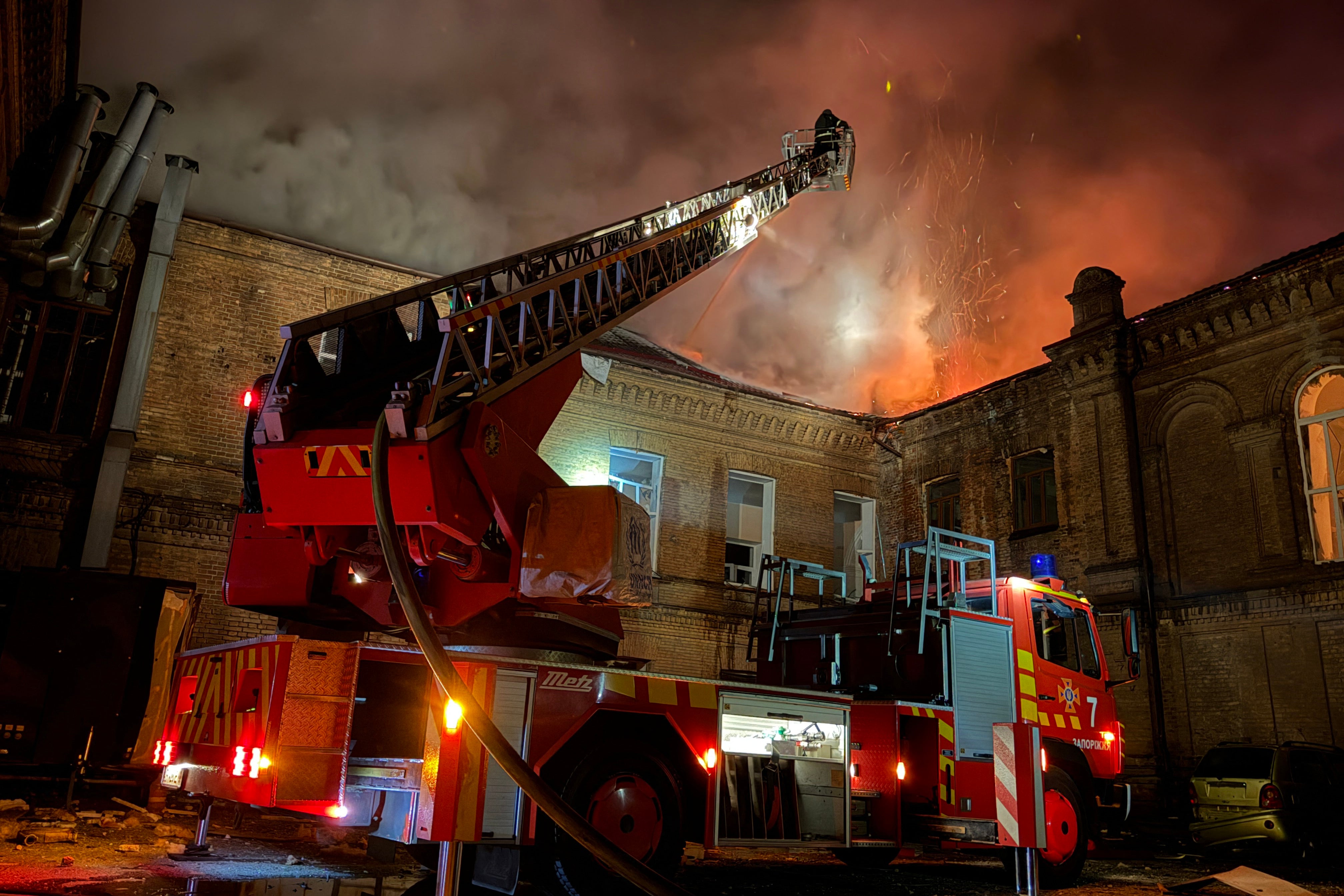 Ukrainian firefighters extinguish a fire at a building of Zaporizhzhia National University following a Russian drone strike in Zaporizhzhia