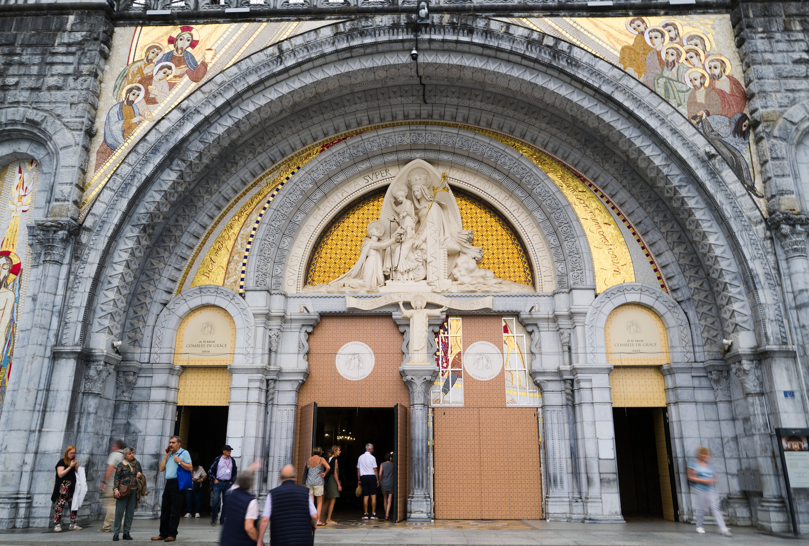 People enter the Notre-Dame-du-Rosaire basilica in Lourdes