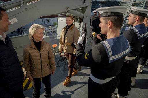 Denmark’s Prime Minister Mette Frederiksen, third left, European Commission President Ursula von der Leyen, second left, and Greenlandic Prime Minister Jens-Frederik Nielsen, left, visit a ship, Thetis in Nuuk, Greenland