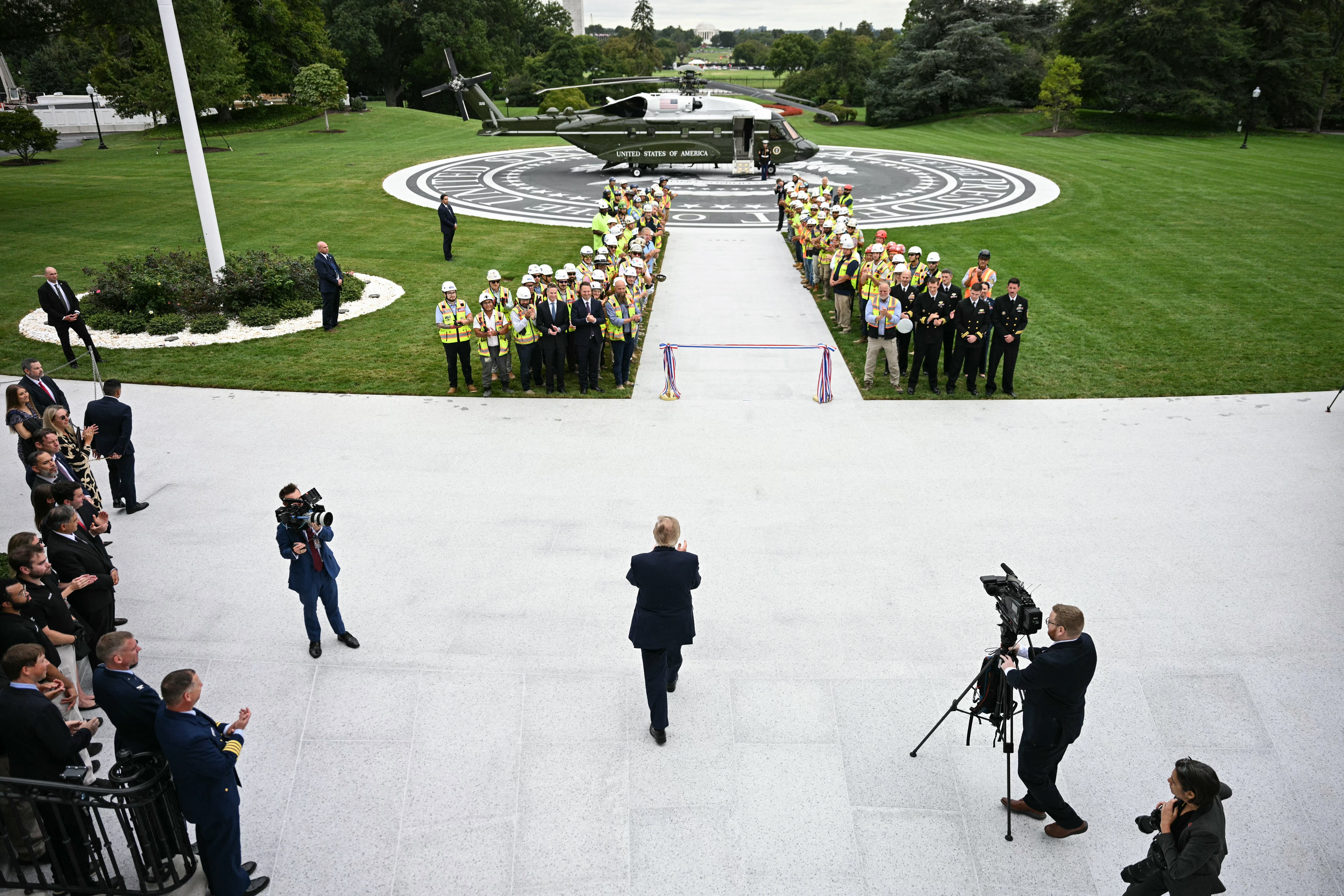 The presidential pool cameras were absent from the ribbon cutting event on Monday (AFP/Getty)