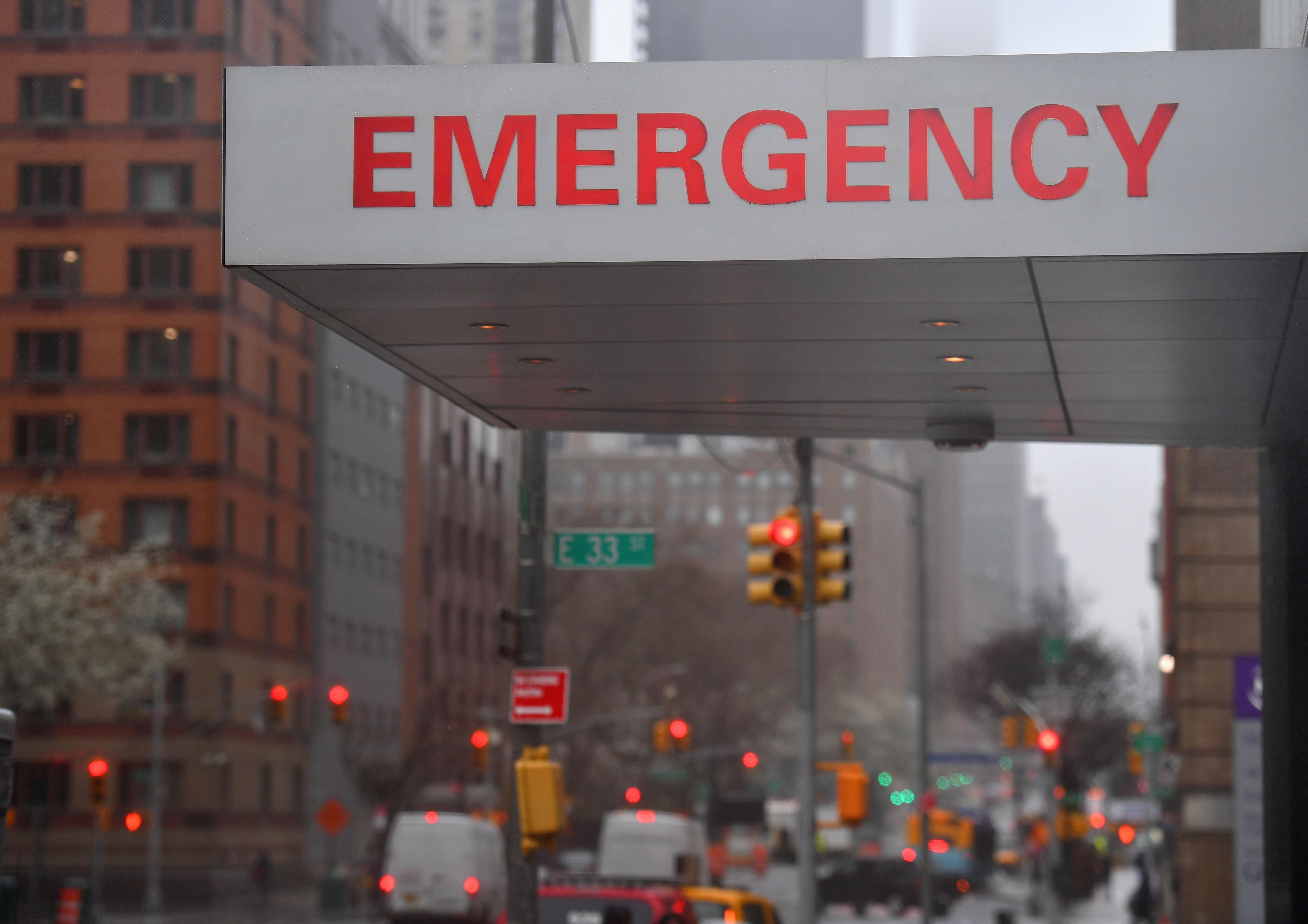 A sign is seen at the NYU Langone Health Center hospital emergency room entrance on March 23