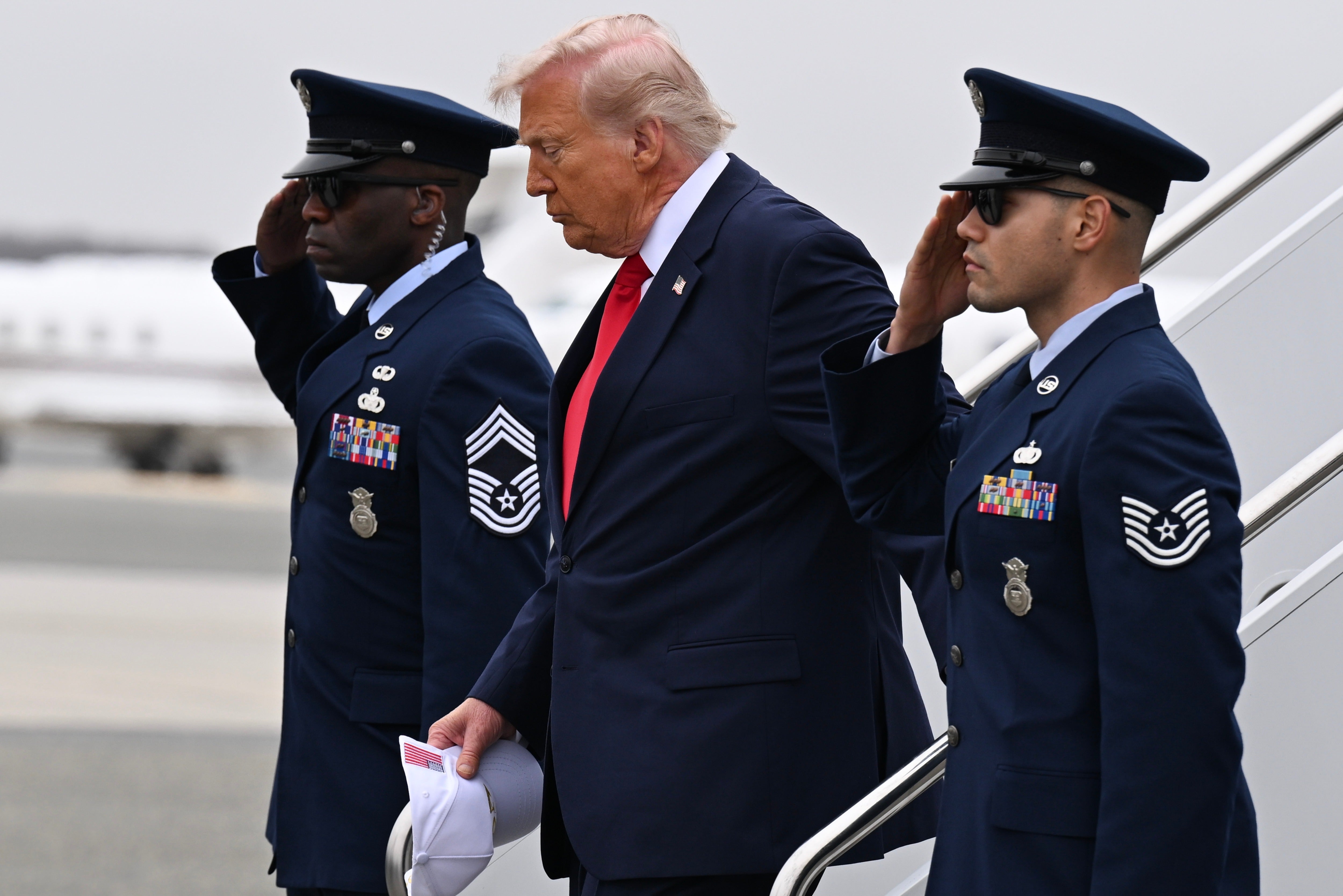 President Donald Trump, pictured at the dignified transfer on March 7, 2026 of six soldiers killed in the Iran war, has repeatedly turned to the justification of 'security' as he seeks to transform his seat of power at home