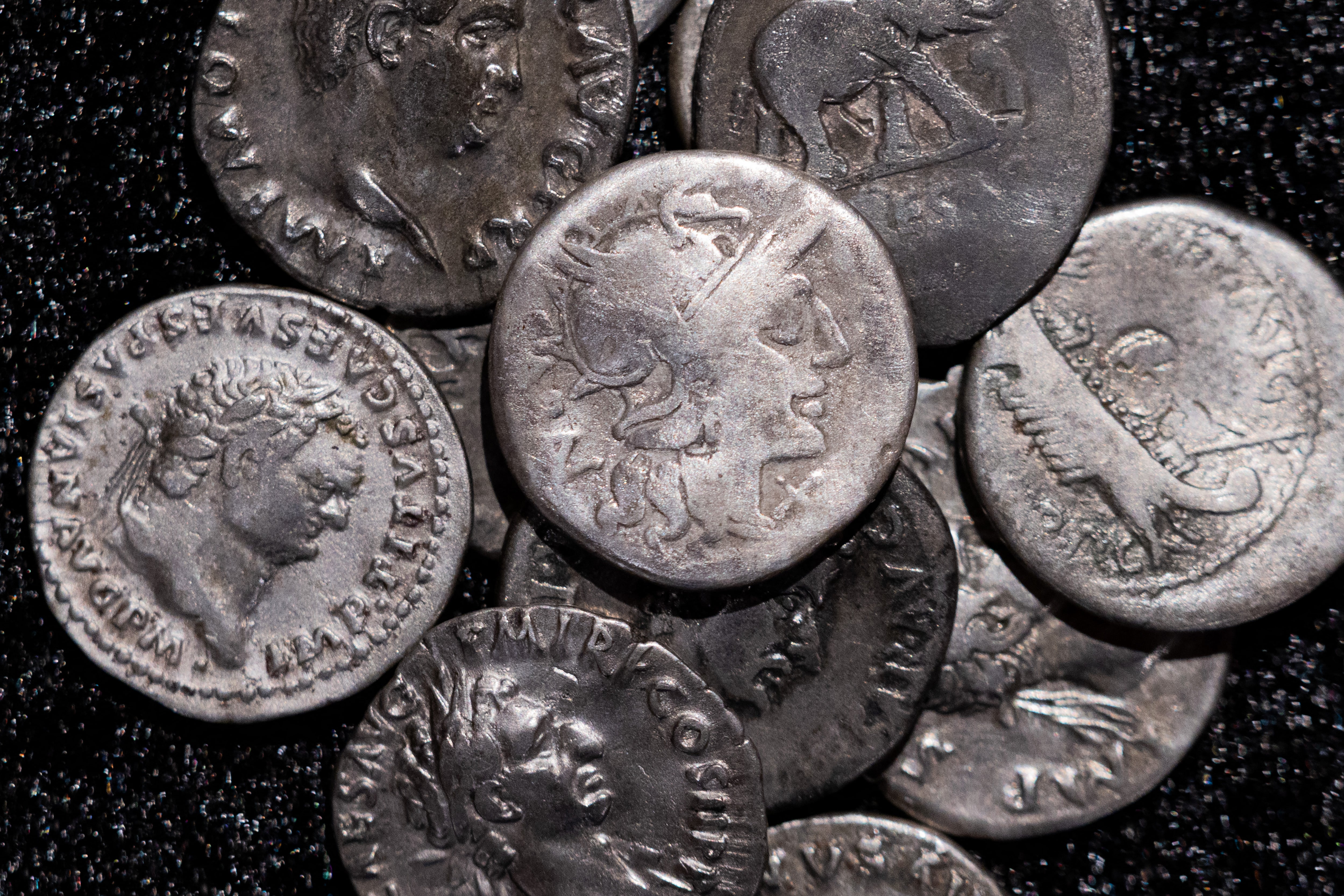Roman coins, including the one coin, centre, dating from 148 B.C., when Rome was still a republic without an emperor, are on display at the LVR State Museum, in Bonn, Germany