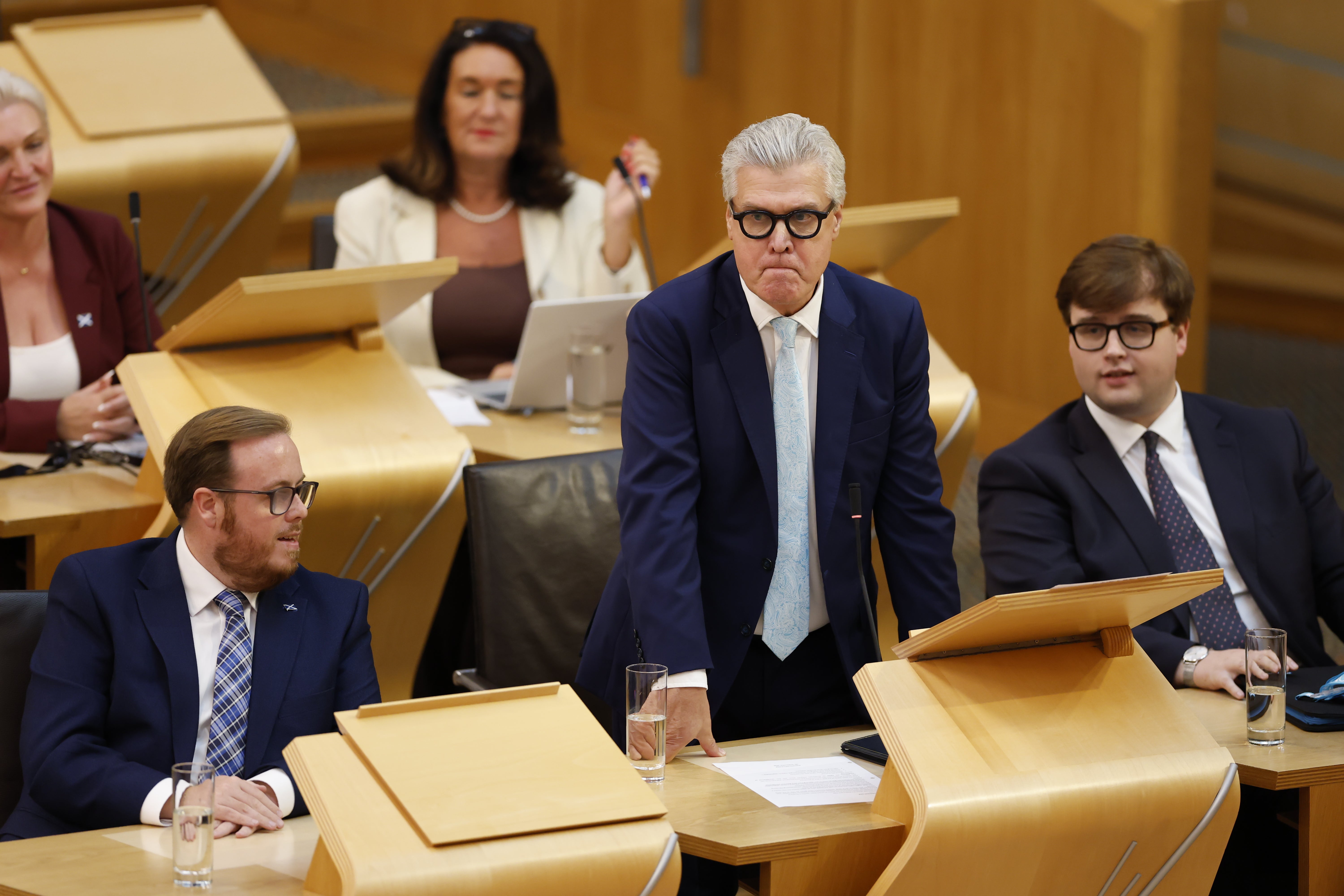 ReformMSPs have walked out of the Holyrood chamber on Tueday