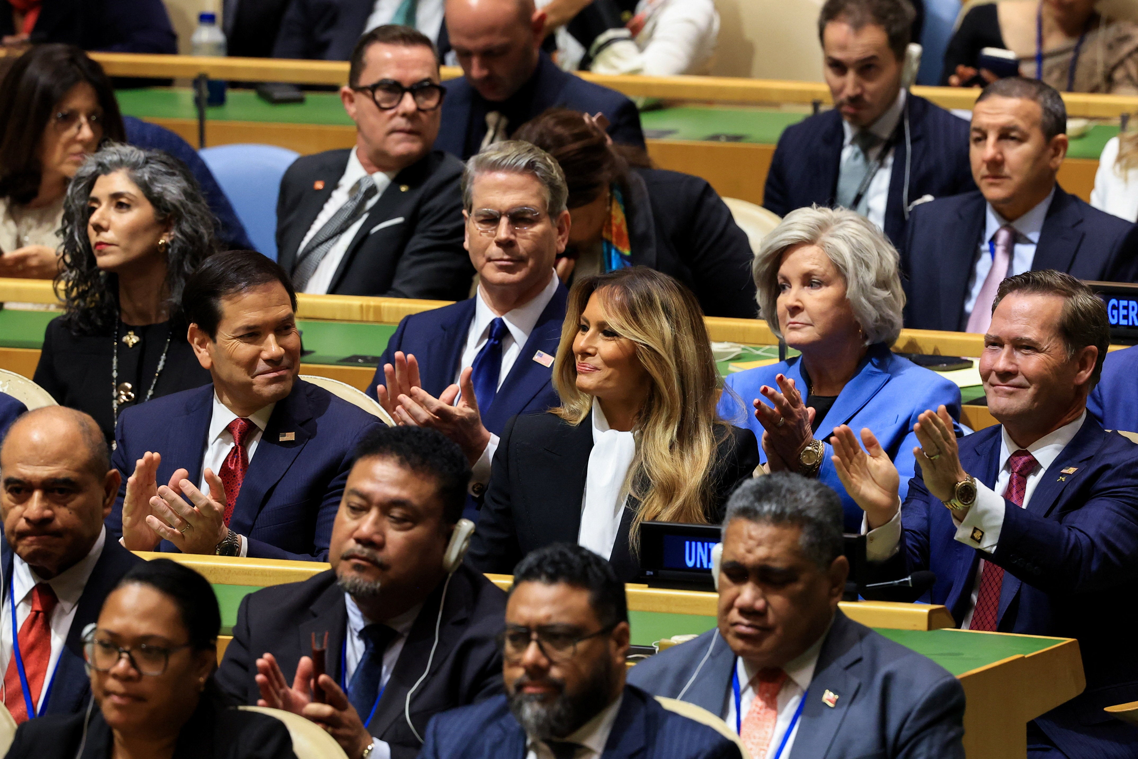 Trump took time out to praise first lady Melania Trump’s global children’s efforts for a moment of applause on the world stage that relied largely on members of his cabinet for the actual clapping