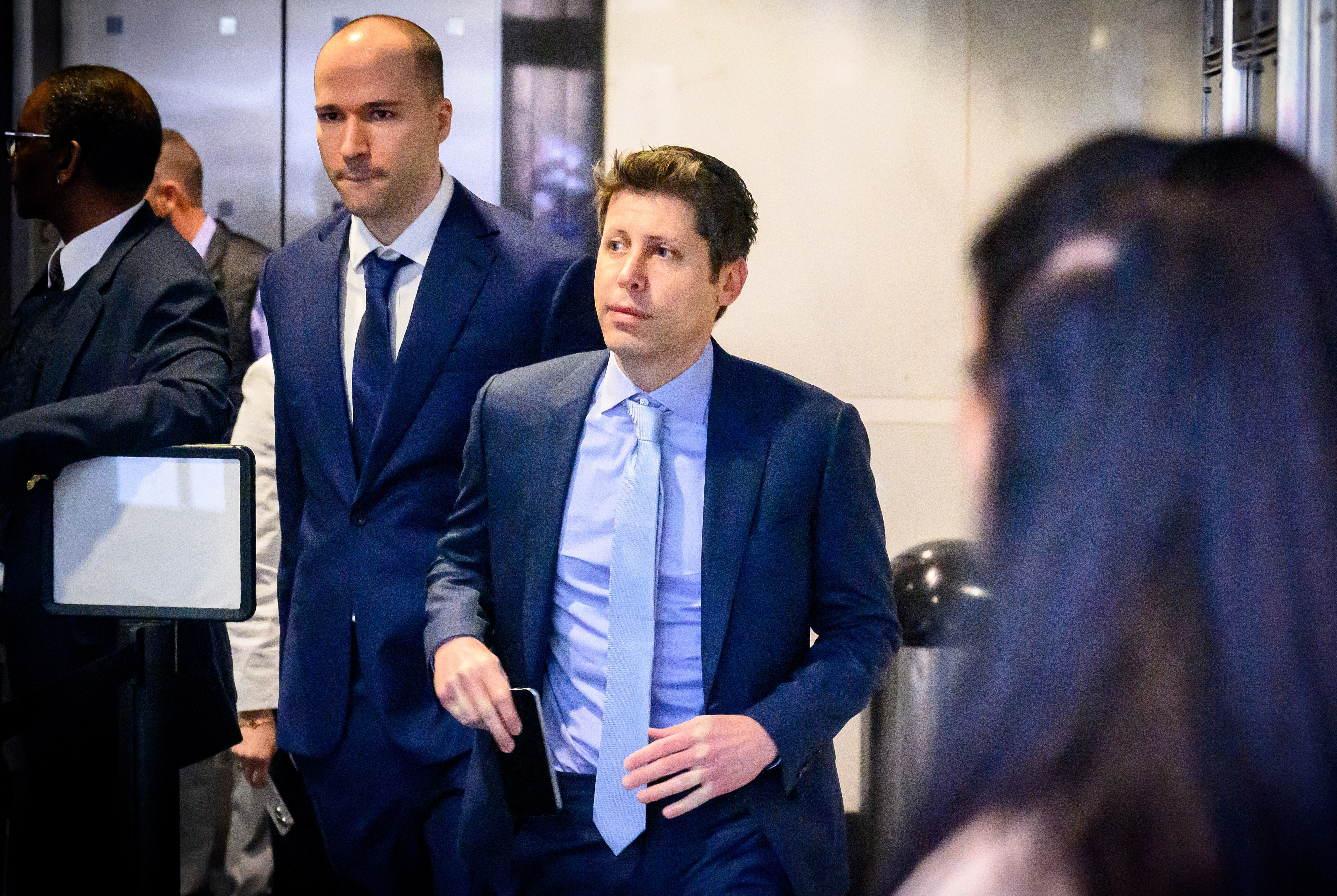 OpenAI President Greg Brockman, left, and CEO Sam Altman, right, will both be attending a state dinner with U.S. President Donald Trump and Chinese President Xi Jinping at the White House this week