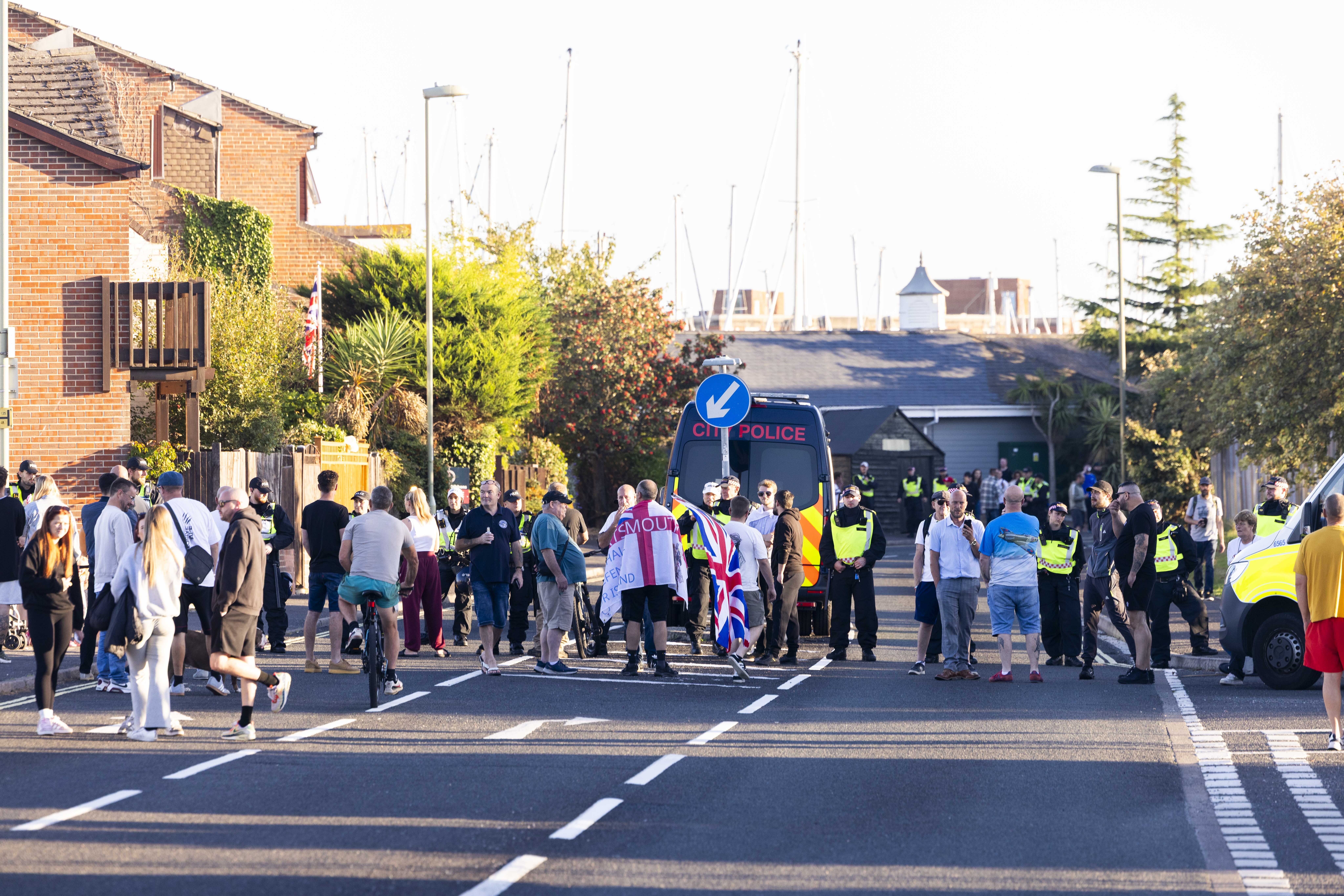Police and protesters in Gosport, Hampshire, after officers closed off the access road to Haslar Marina (Trevor Adams/PA)