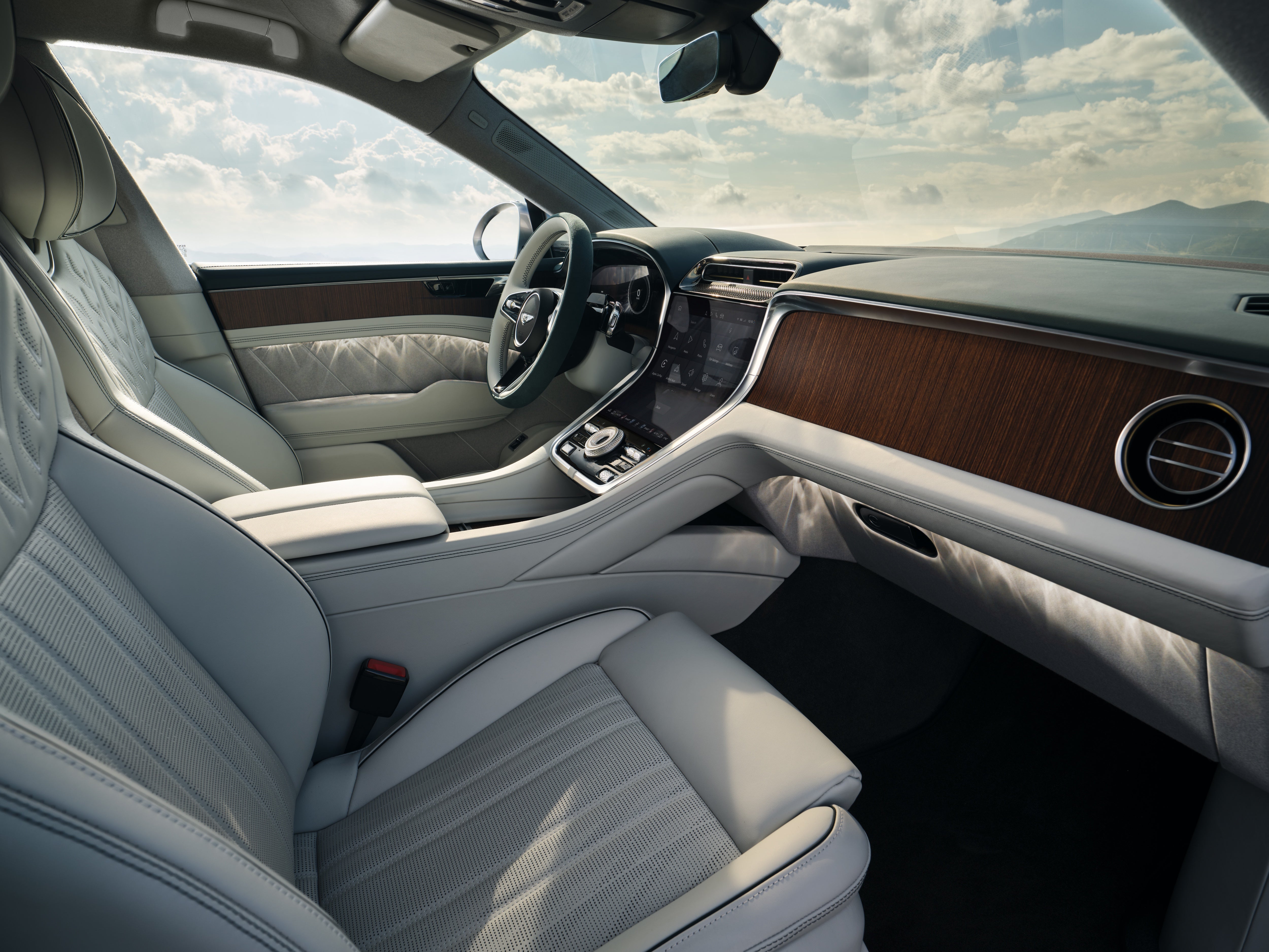 Bentley resisted the urge to go screen heavy, preferring to showcase its use of wood veneer to putting a screen in front of the passenger (Bentley)