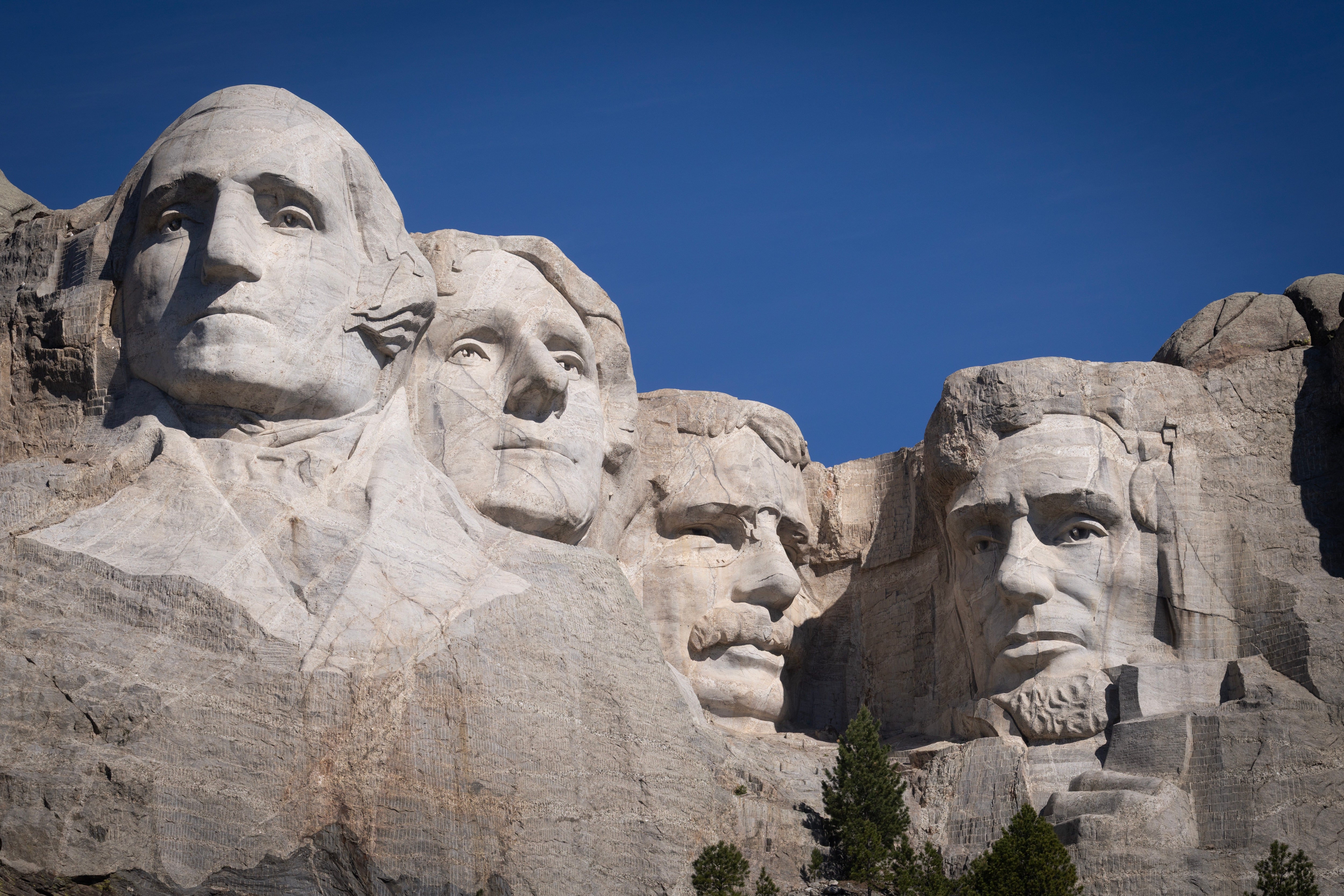 US presidents George Washington, Thomas Jefferson, Theodore Roosevelt and Abraham Lincoln tower over the landscape at Mount Rushmore (Getty)