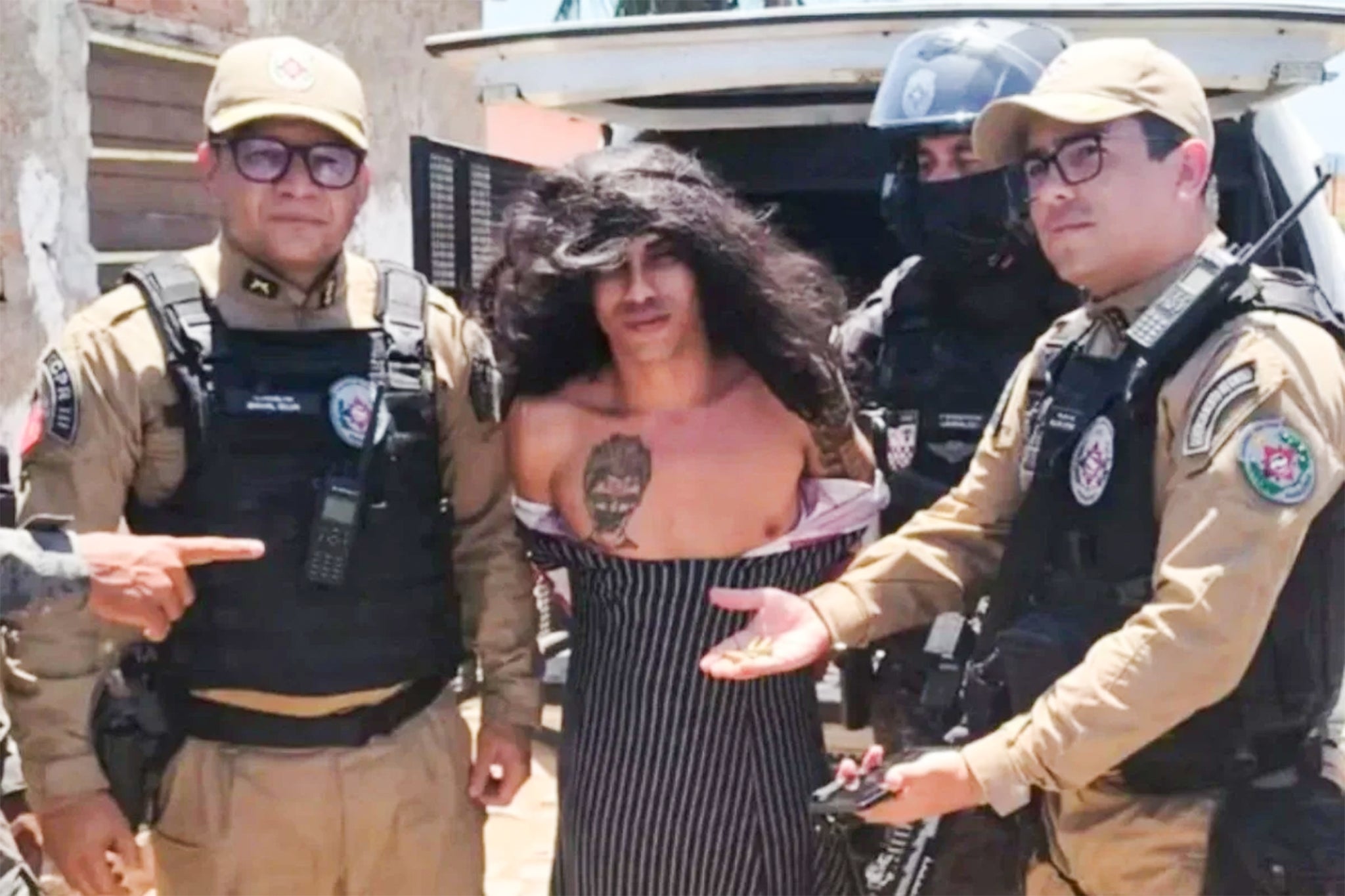 A picture provided by Brazilian authorities show Jorlan Lopes da Silva, 33, being taken into custody on September 13