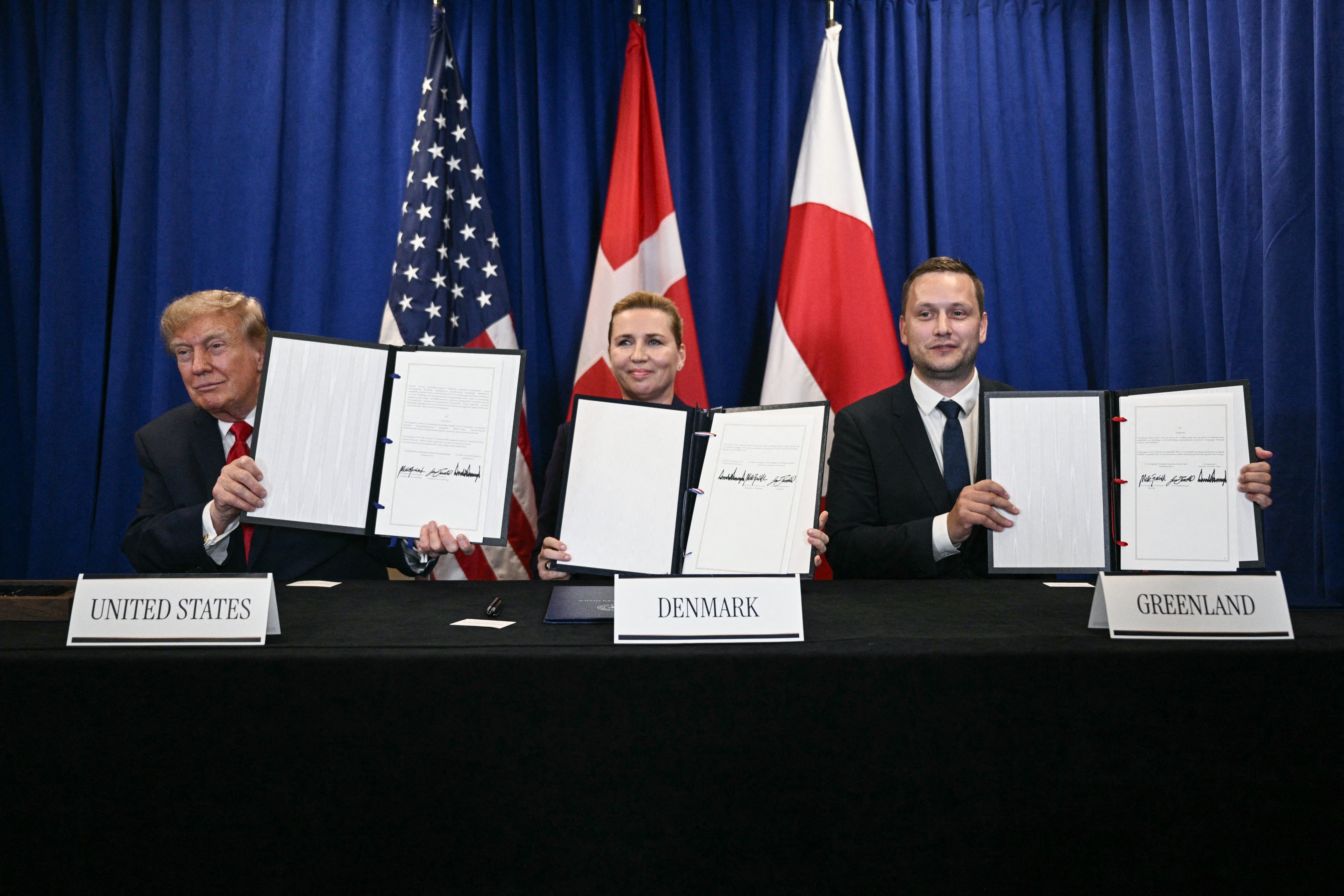 Trump, Denmark's Prime Minister Mette Frederiksen and Greenland's Prime Minister Jens-Frederik Nielsen sign a trilateral security deal on the sidelines of the UN General Assembly (AFP via Getty Images)