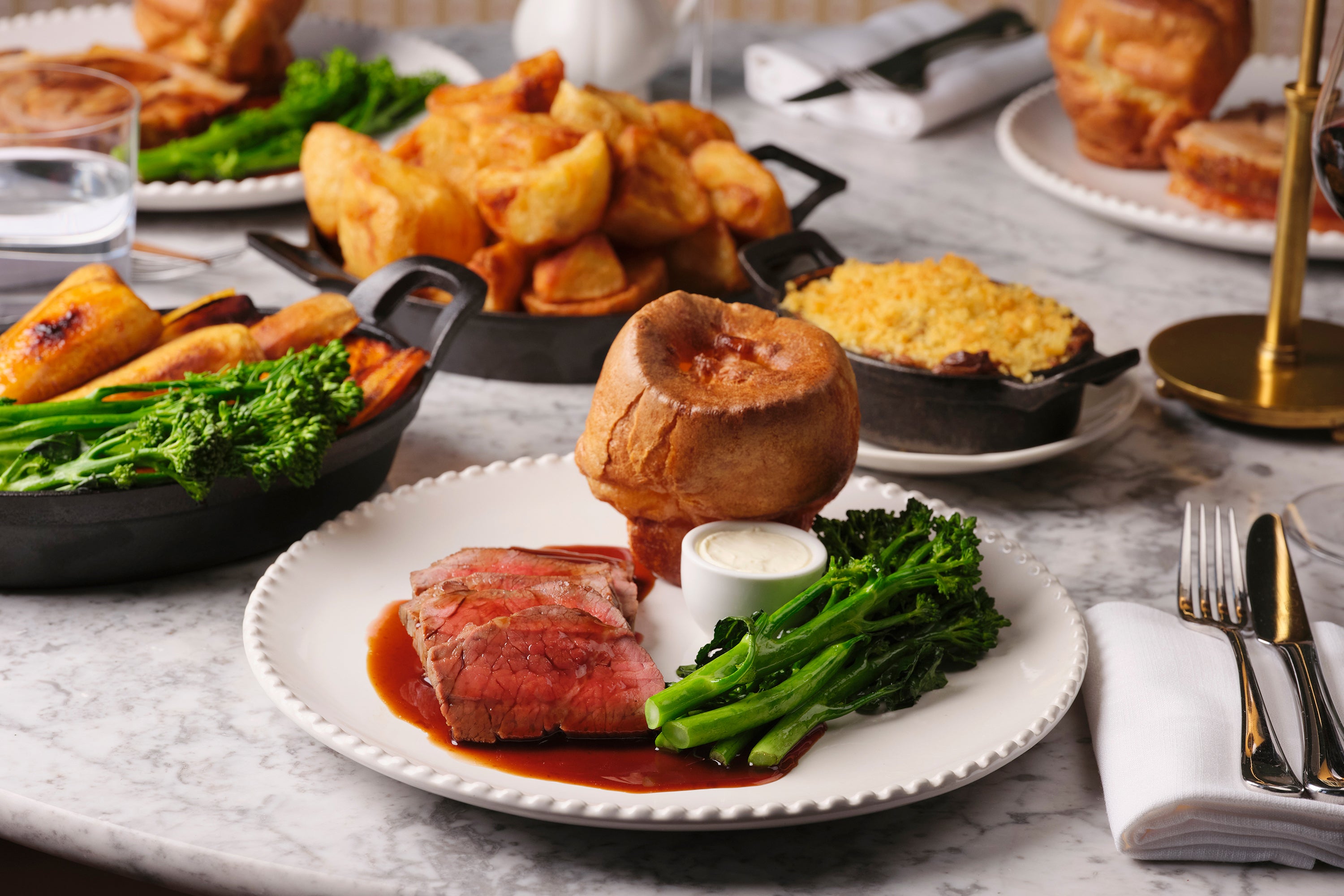 Abé keeps the bones of the Sunday roast intact – crisp potatoes, Yorkshire pudding and proper gravy – but makes a case for ketchup with her roasted tomato version (Sally Abe/Light Speed)