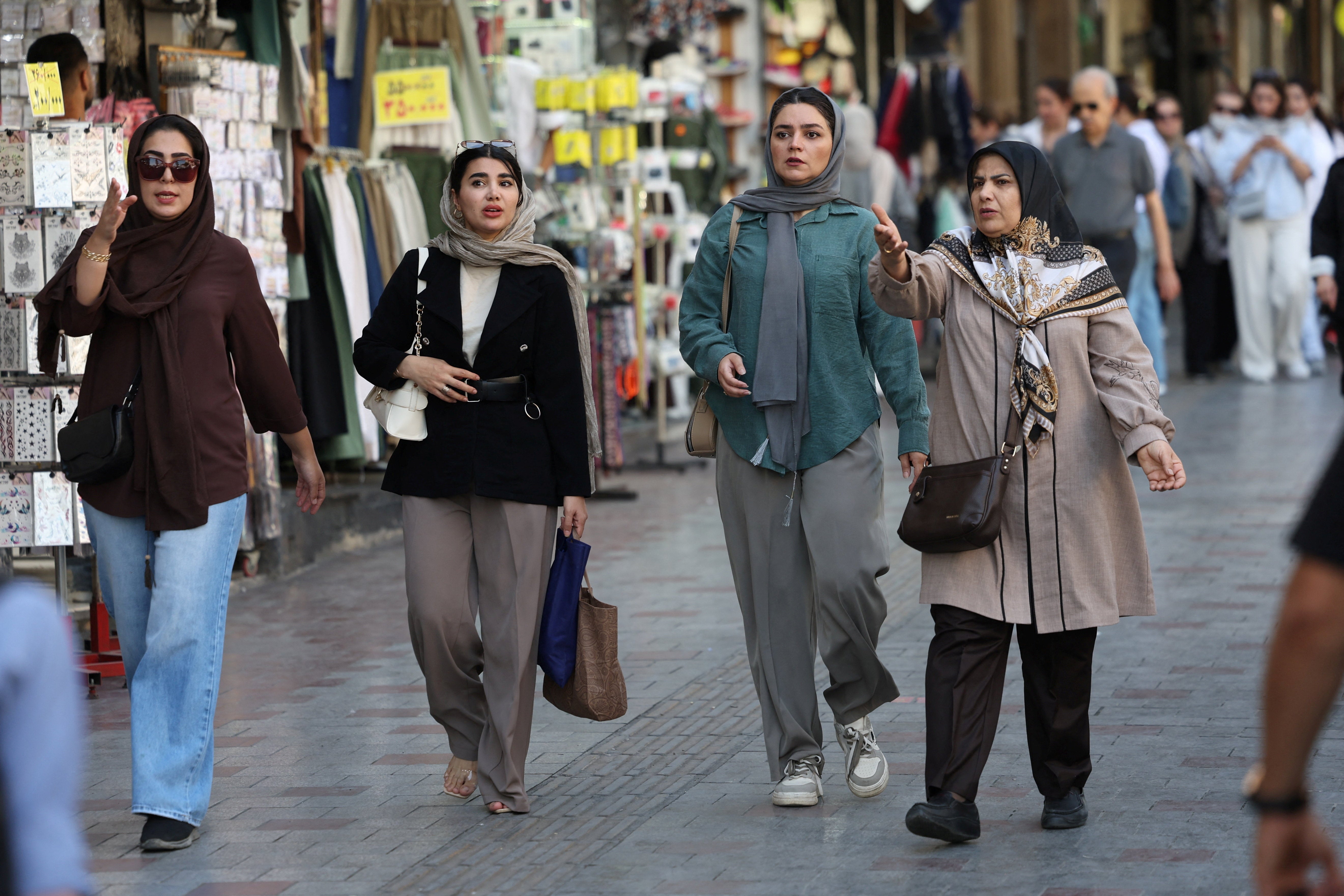 People walk on a street in Tehran, Iran (Reuters)