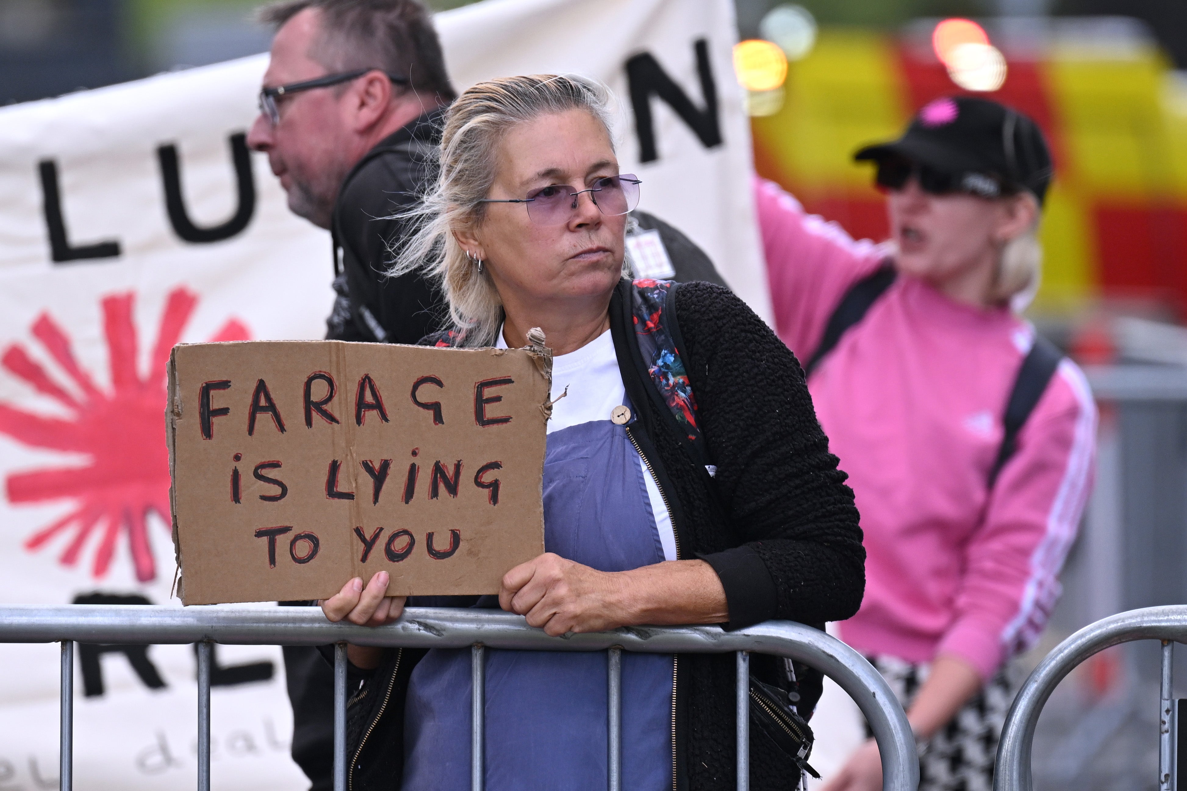 Protesters outside the venue on the second day of the Reform Party conference.