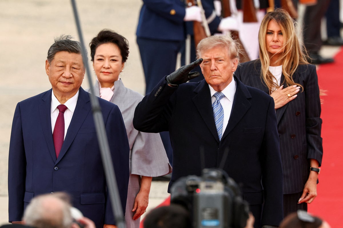 Trump mocked as he greets Xi in winter gear during unusual airport greeting