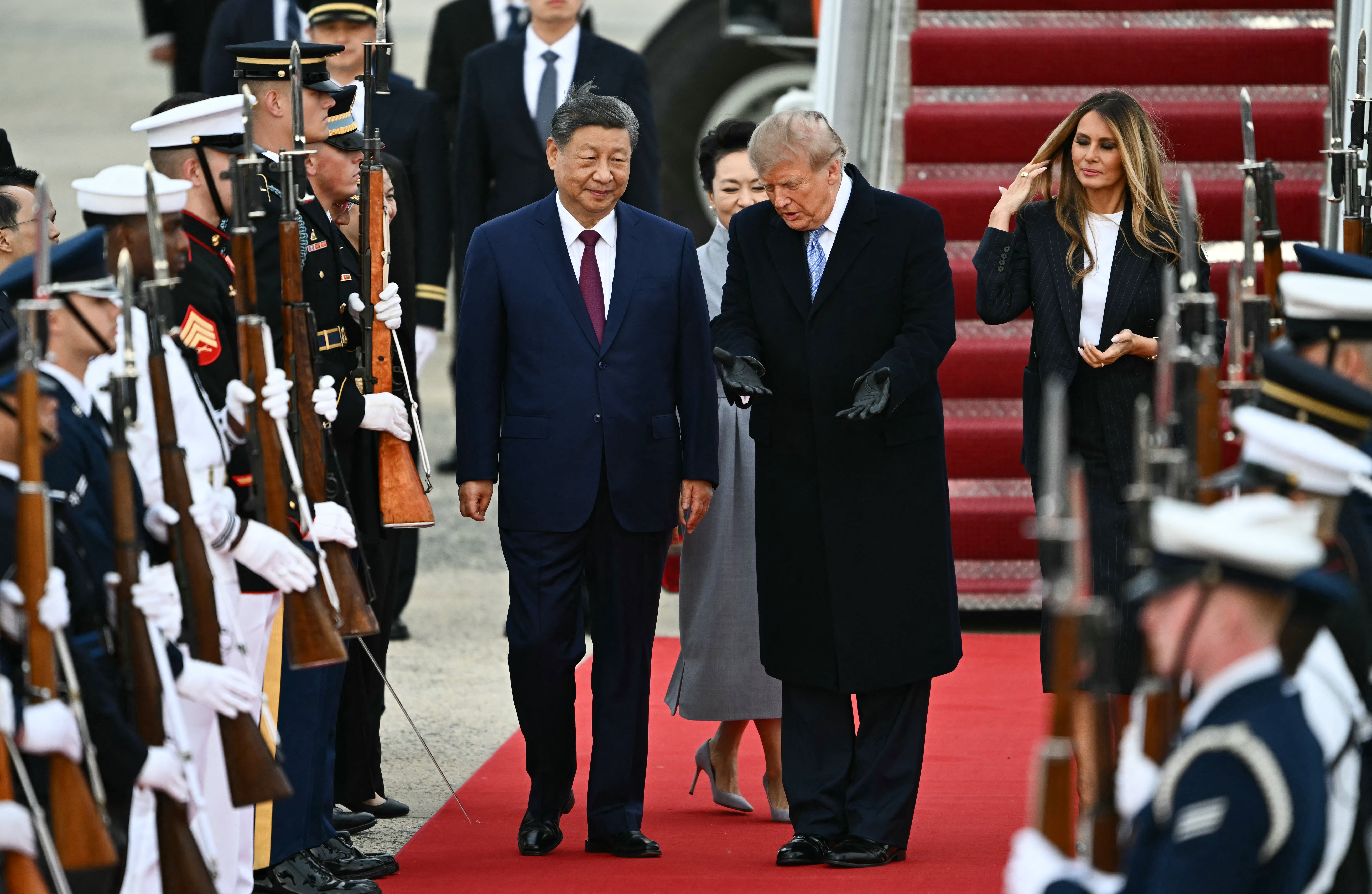 Donald Trump rolled out the red carpet in an unusual airport greeting for Xi Jinping on Wednesday