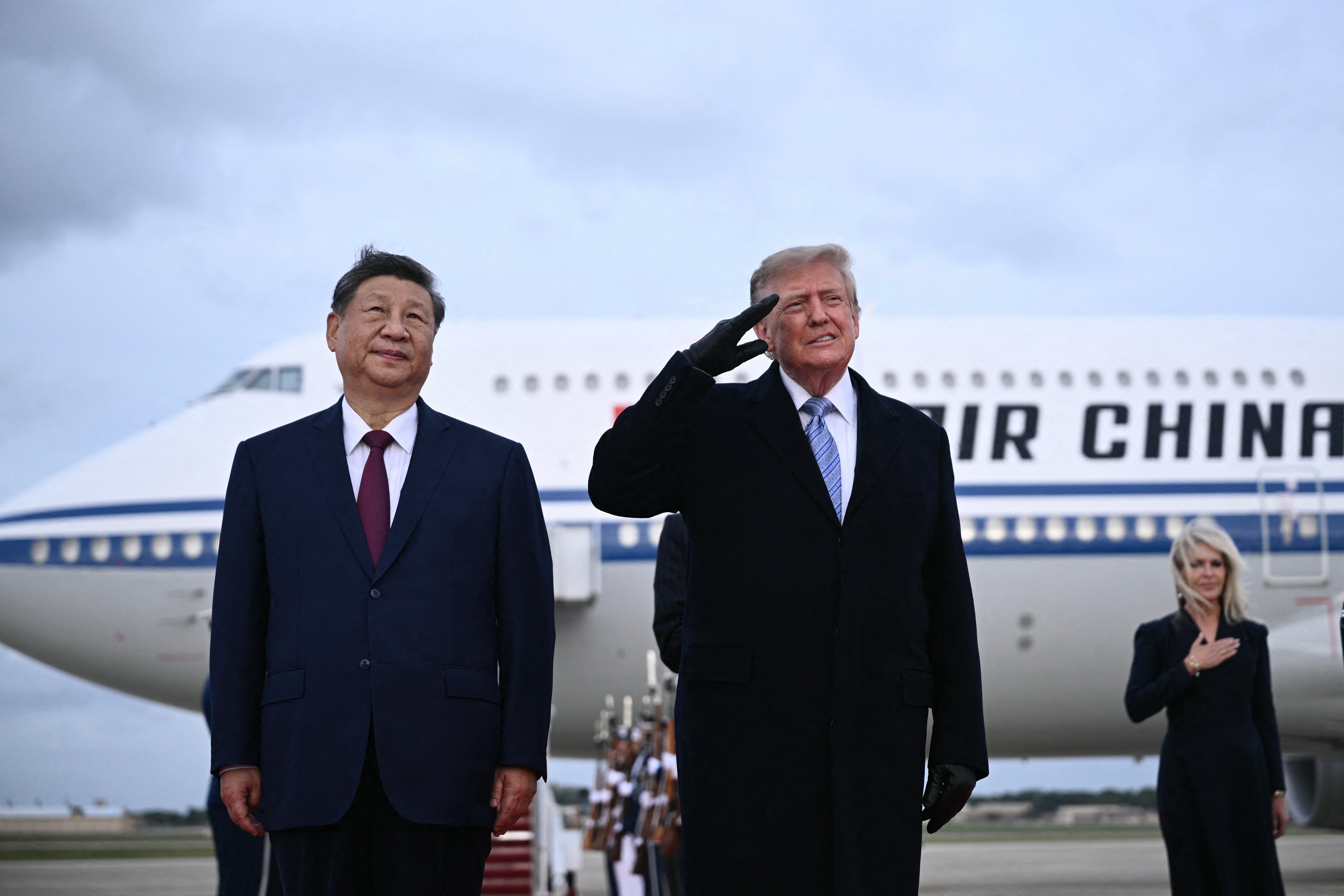 Trump winced as a U.S. military jet completed a flyover during Xi's arrival ceremony