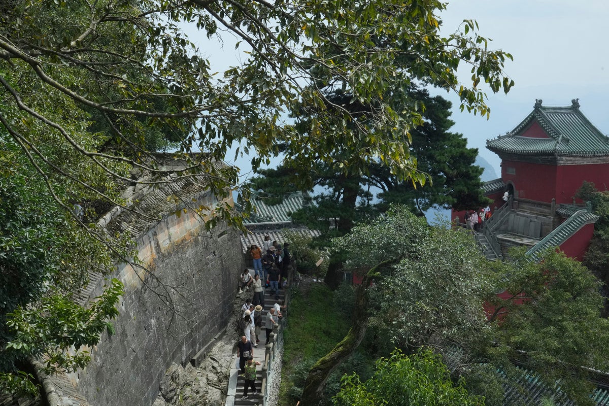 Some climb for faith, others for the views. This Chinese sacred mountain draws them all