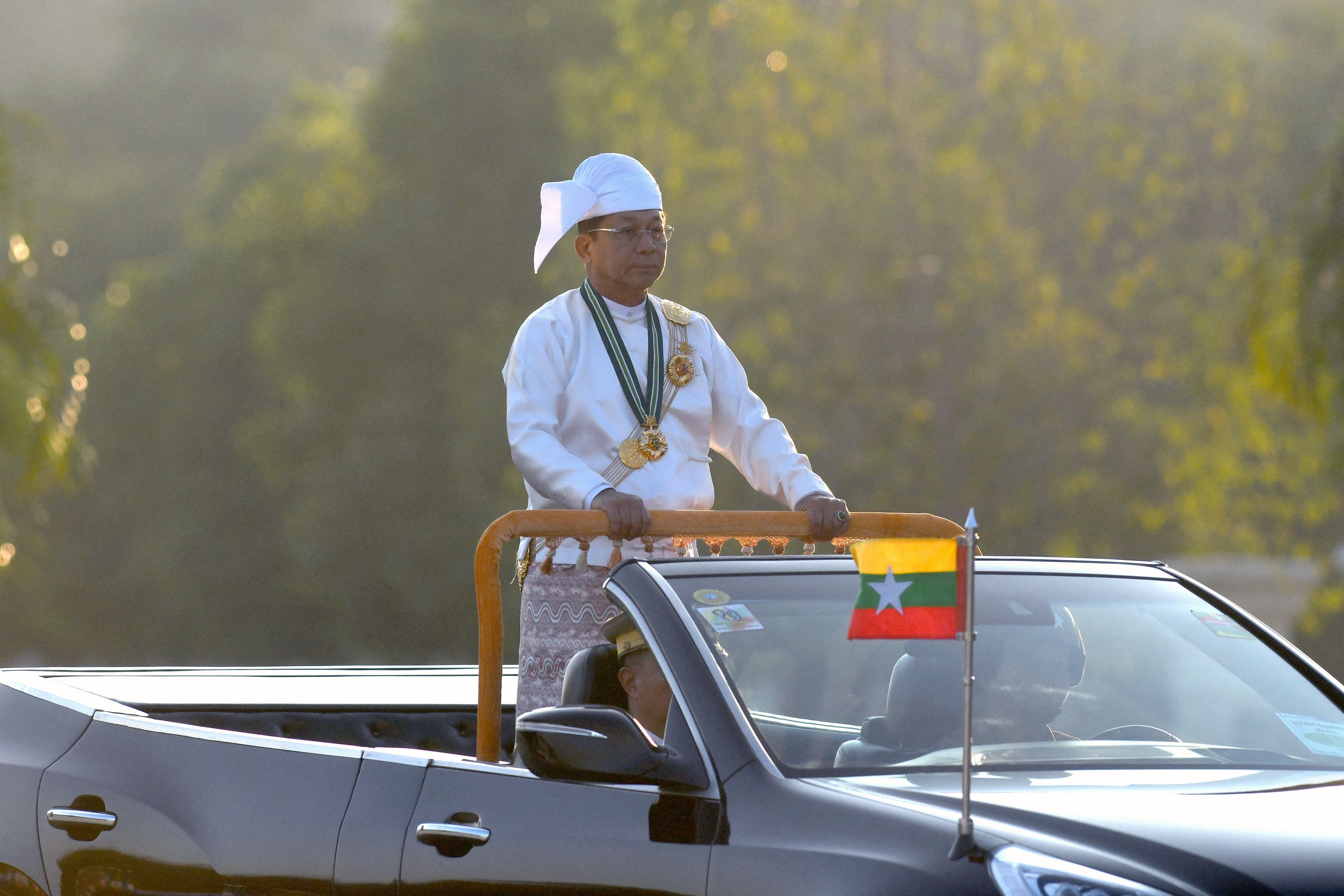 Min Aung Hlaing oversees a military display to mark Myanmar’s Independence Day in Naypyidaw (AFP/Getty)