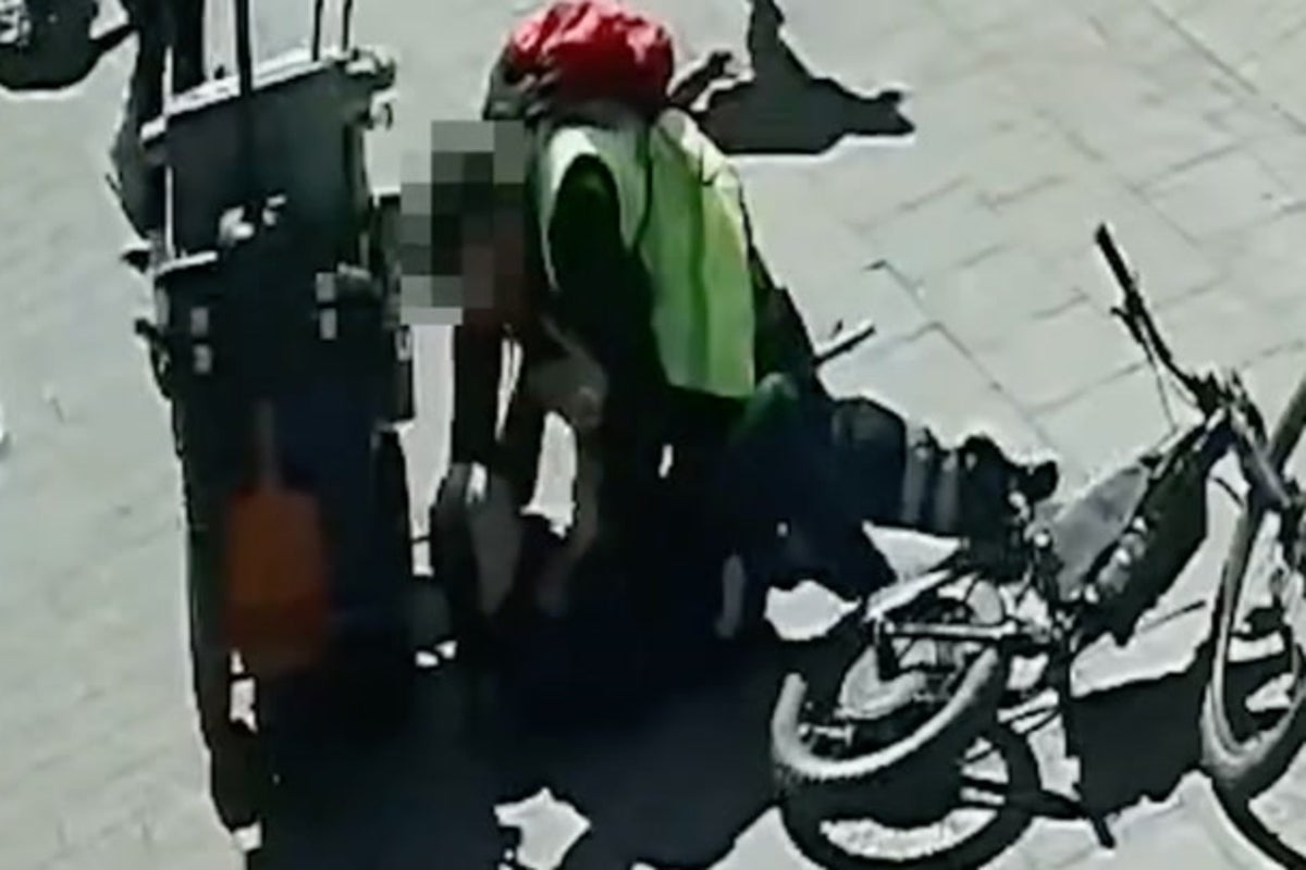 Moment police disguised as food delivery driver and street cleaner pounce on knife suspect