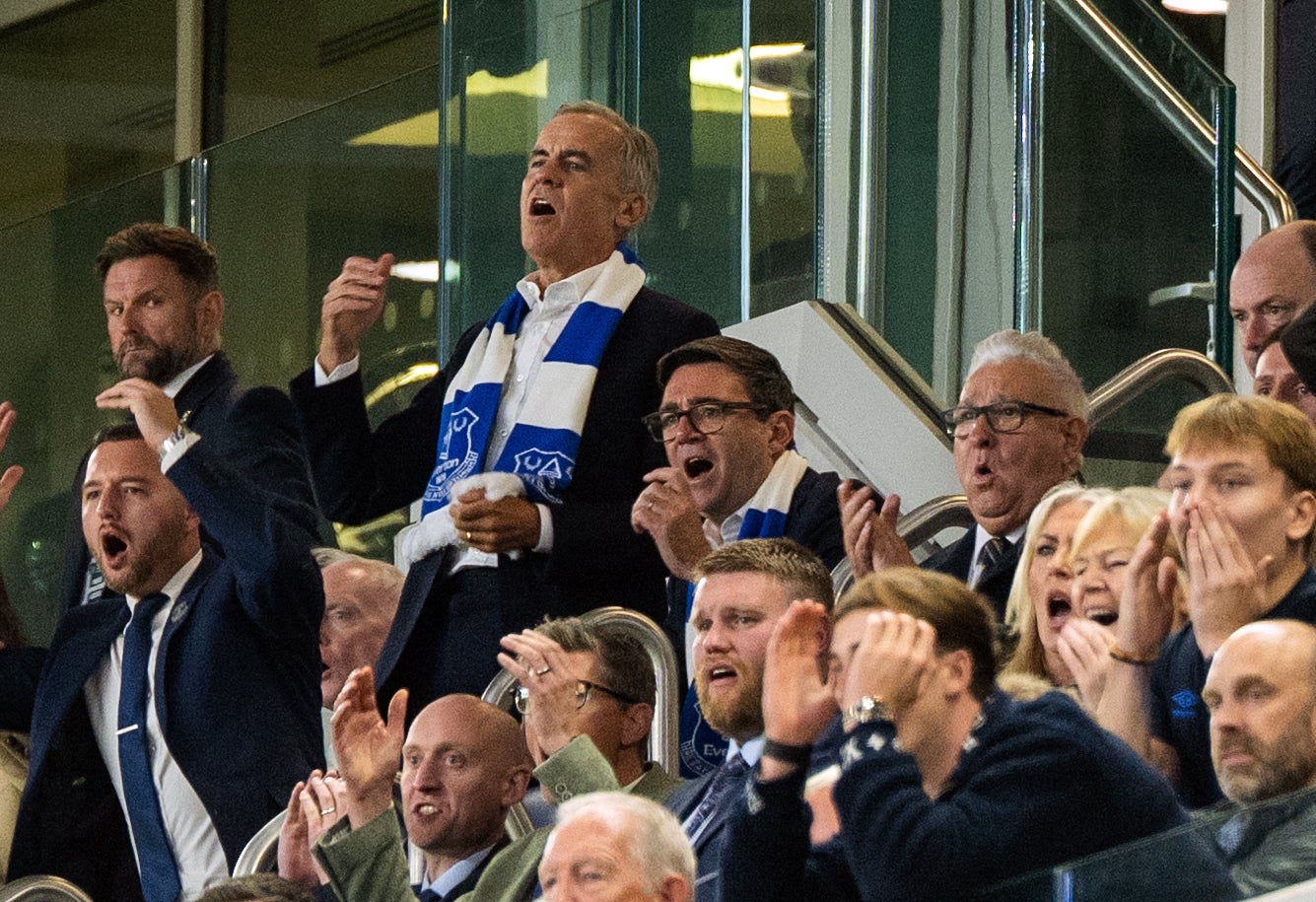 Burnham attended an Everton match with Mark Carney last week (PA Wire)