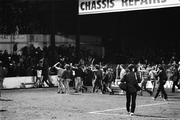 Fans invade the field during the 'Luton Riot' in 1985