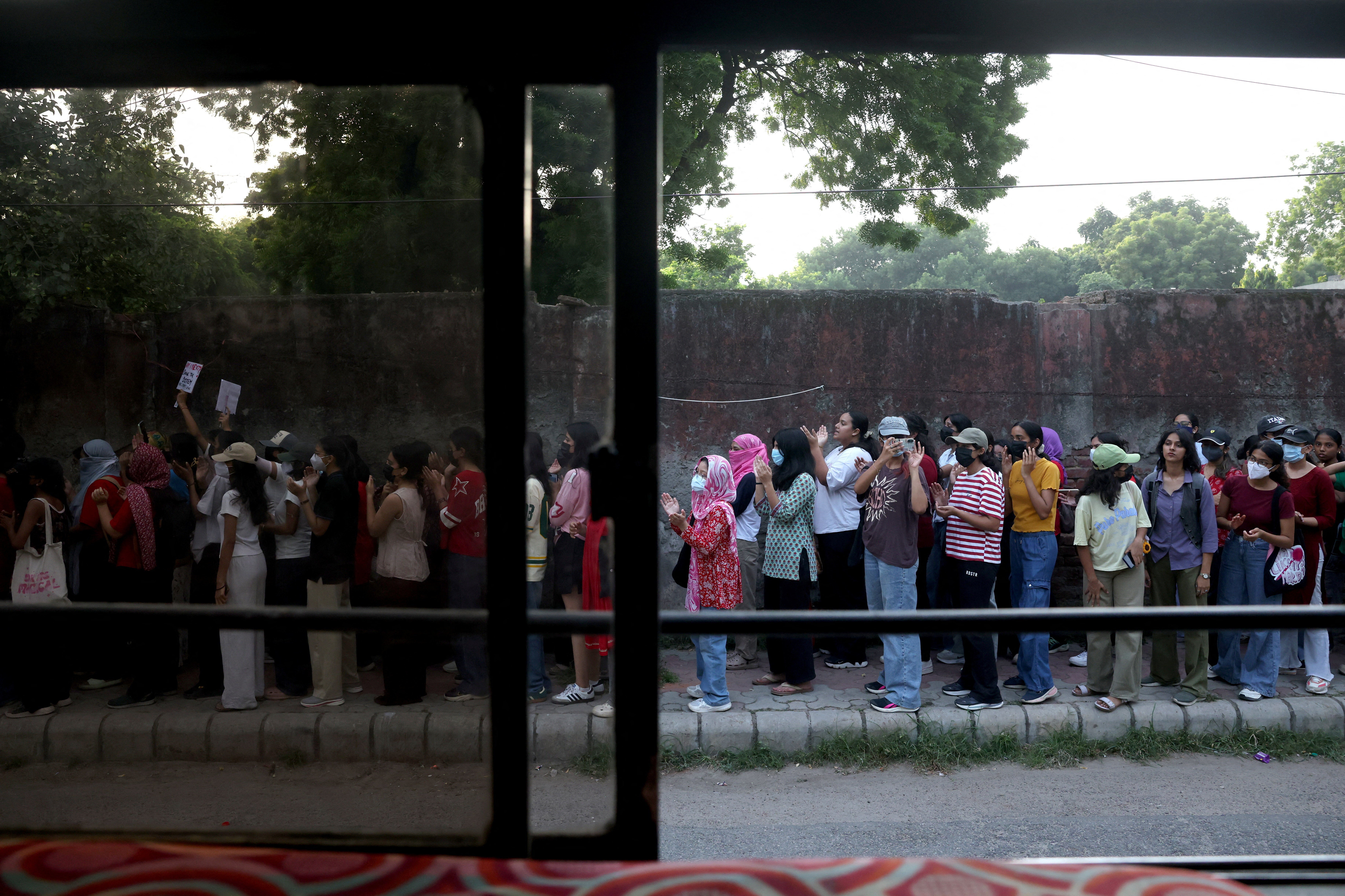College students shout slogans during a solidarity march demanding police action and better safety for women (Reuters)