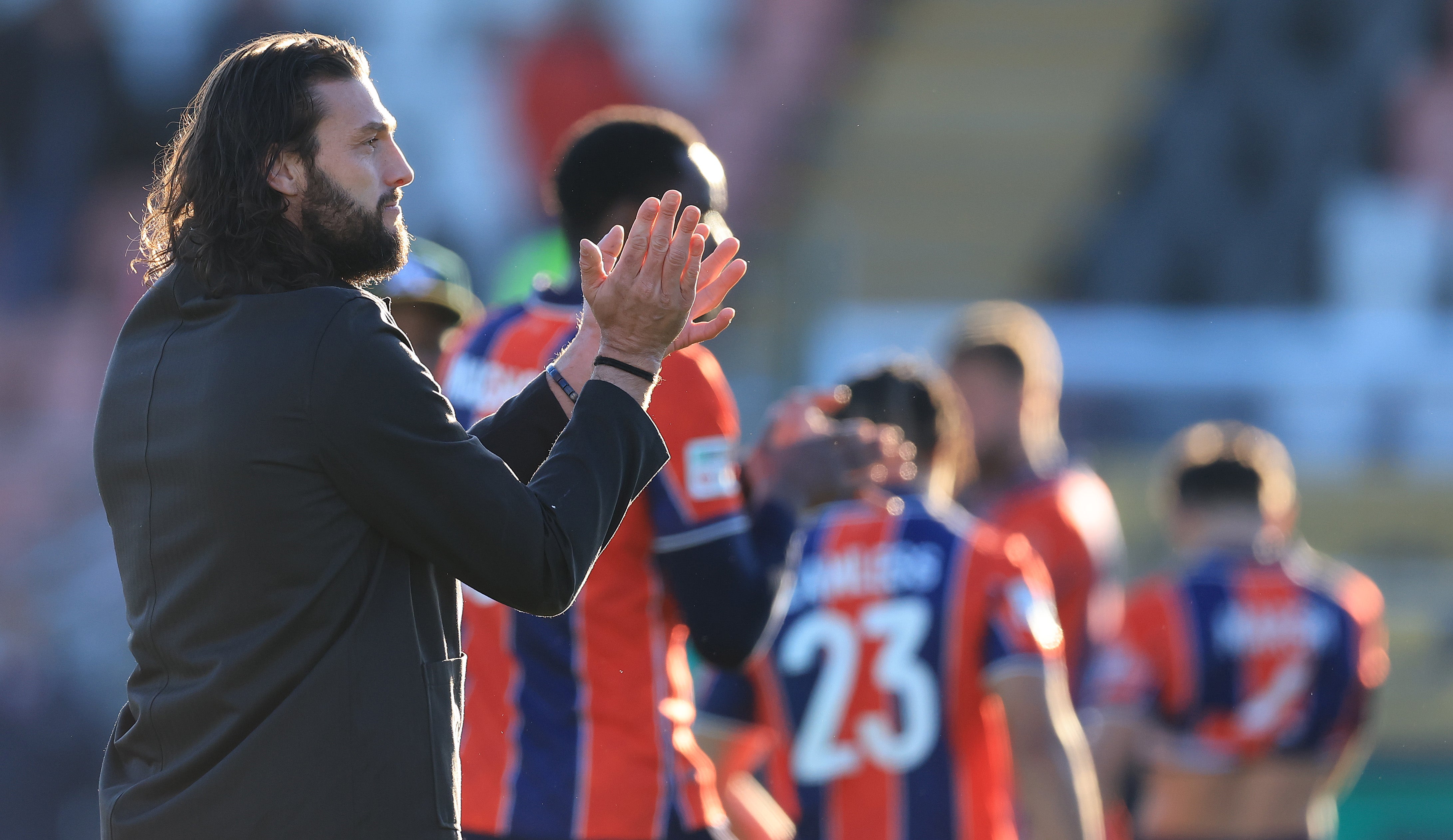 Carroll applauds fans after a National League South match between Dagenham & Redbridge and Torquay United