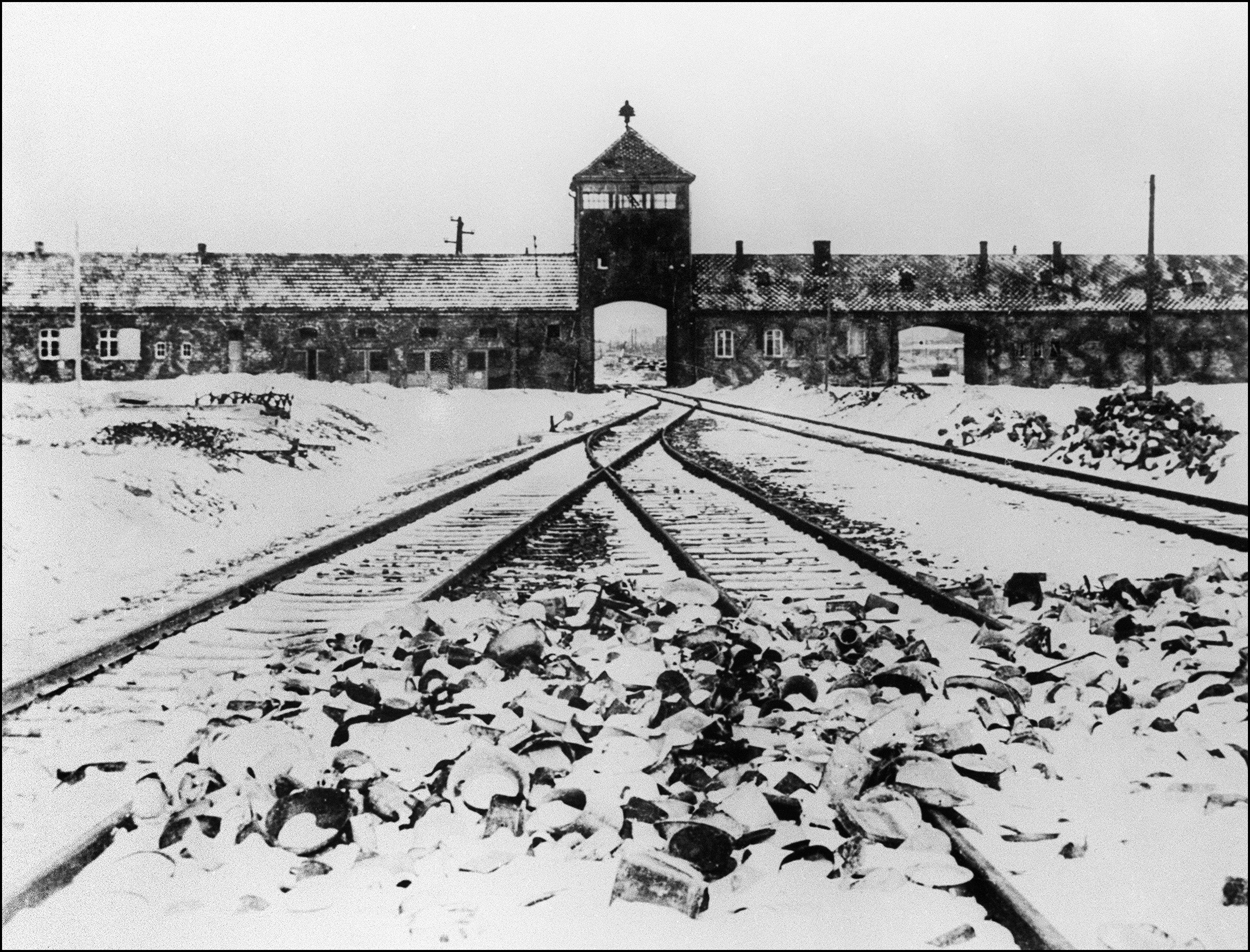 The Auschwitz concentration camp gate and railways after its liberation by Soviet troops in 1945 (AFP/Getty)