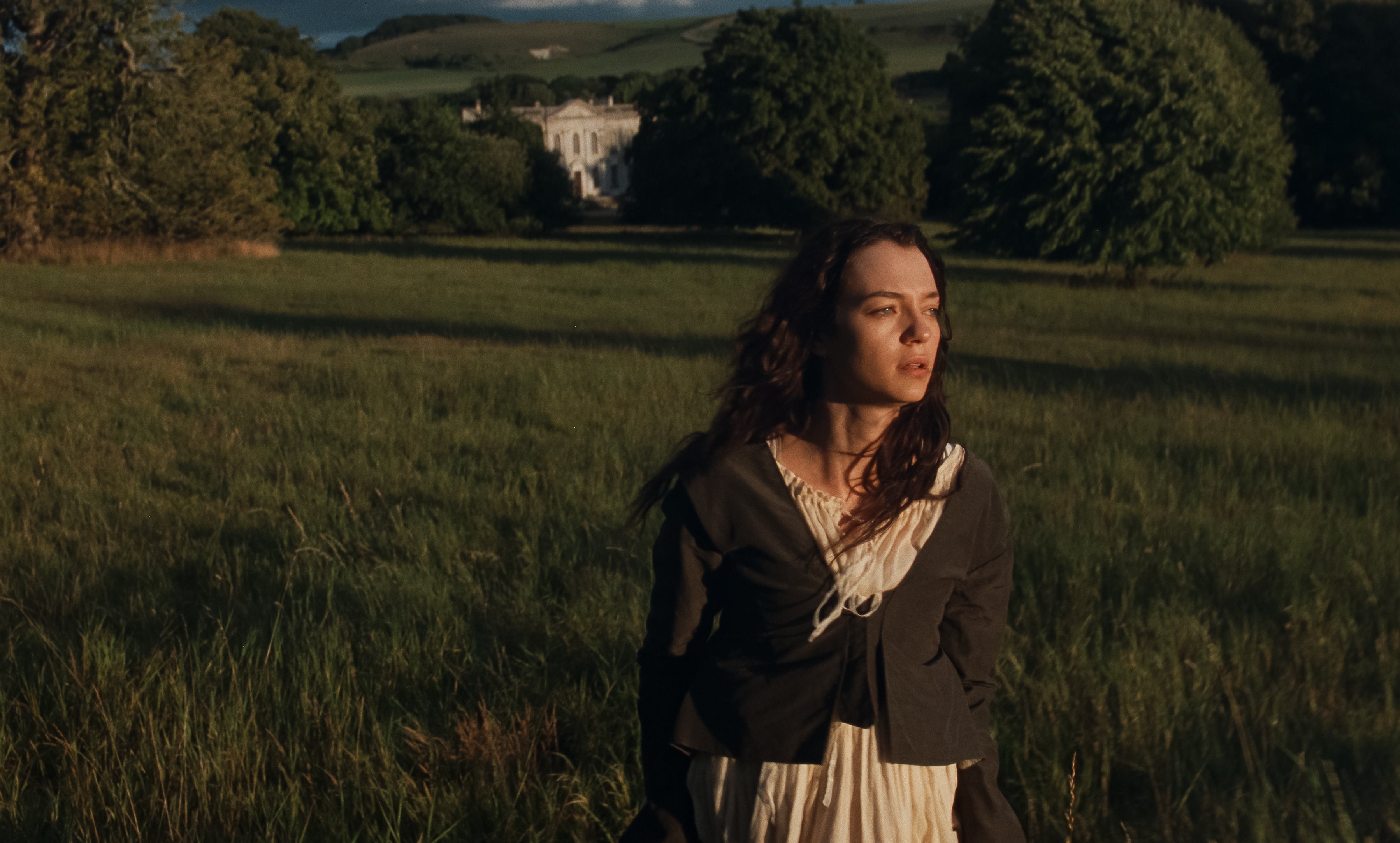 Esmé Creed-Miles as Marianne, with King Russell House in the background, serving as the setting for the Dashwood family home, Norland Park
