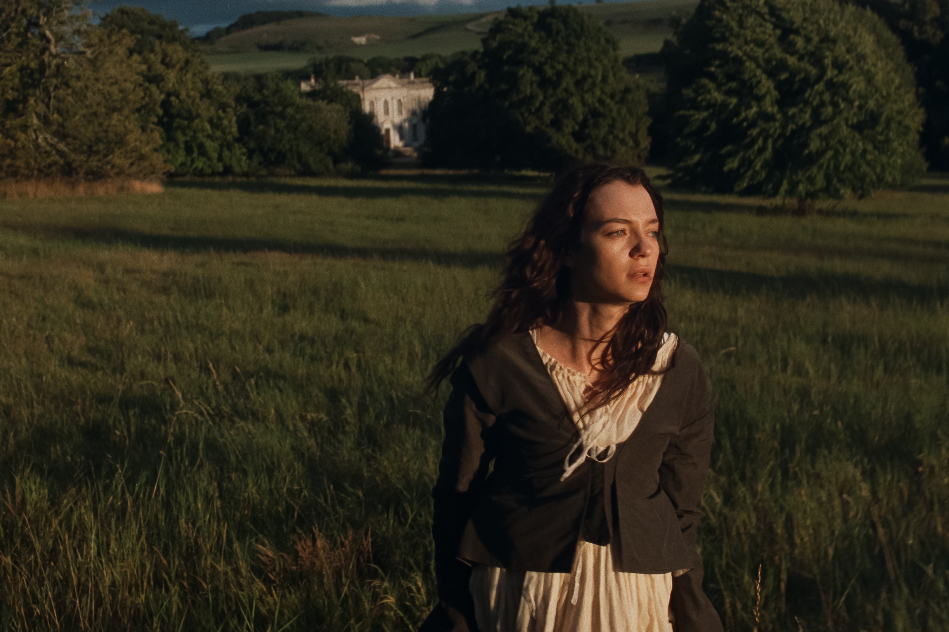 Esmé Creed-Miles as Marianne, with King Russell House in the background, serving as the setting for the Dashwood family home, Norland Park (Focus Features)