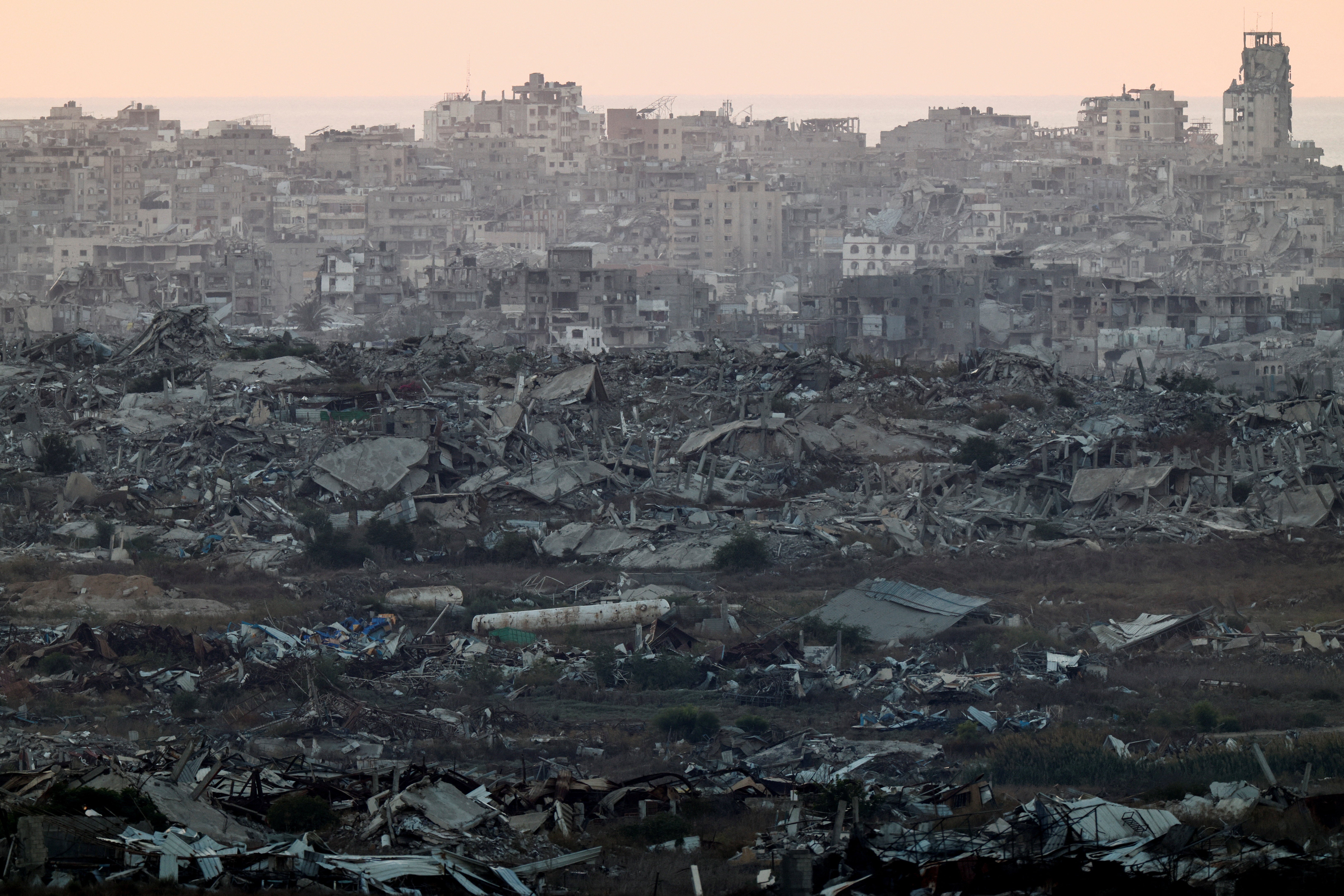 Destroyed and damaged buildings remain in Gaza, as seen from the Israeli side of the border, September 23, 2026. (Reuters)