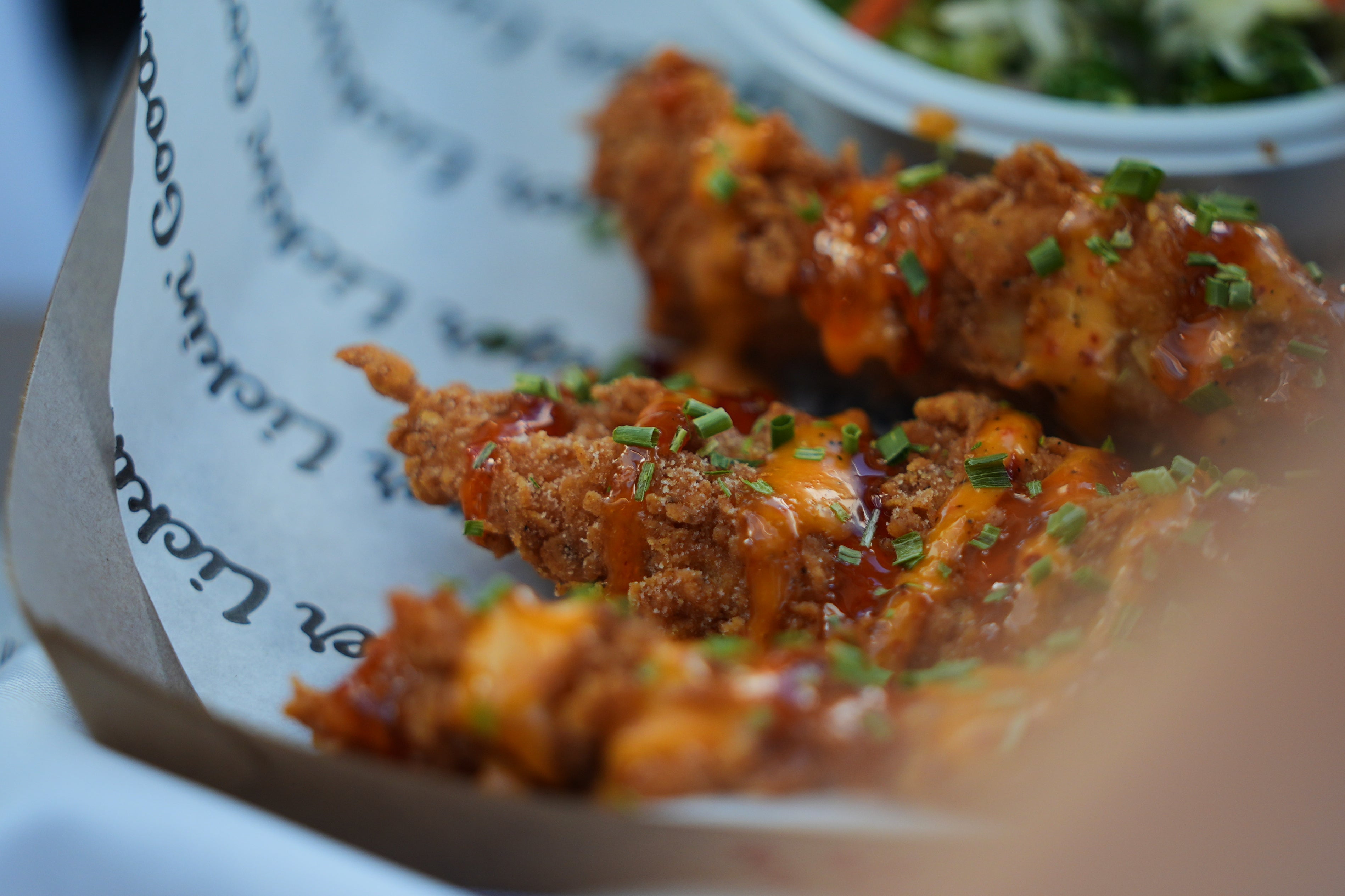 Its menu introduces specialty beverages including boba refreshers and milkshakes topped with crunchy bits, alongside a broader selection of chicken tenders, dipping sauces, and sides like spicy pickles and fried green beans