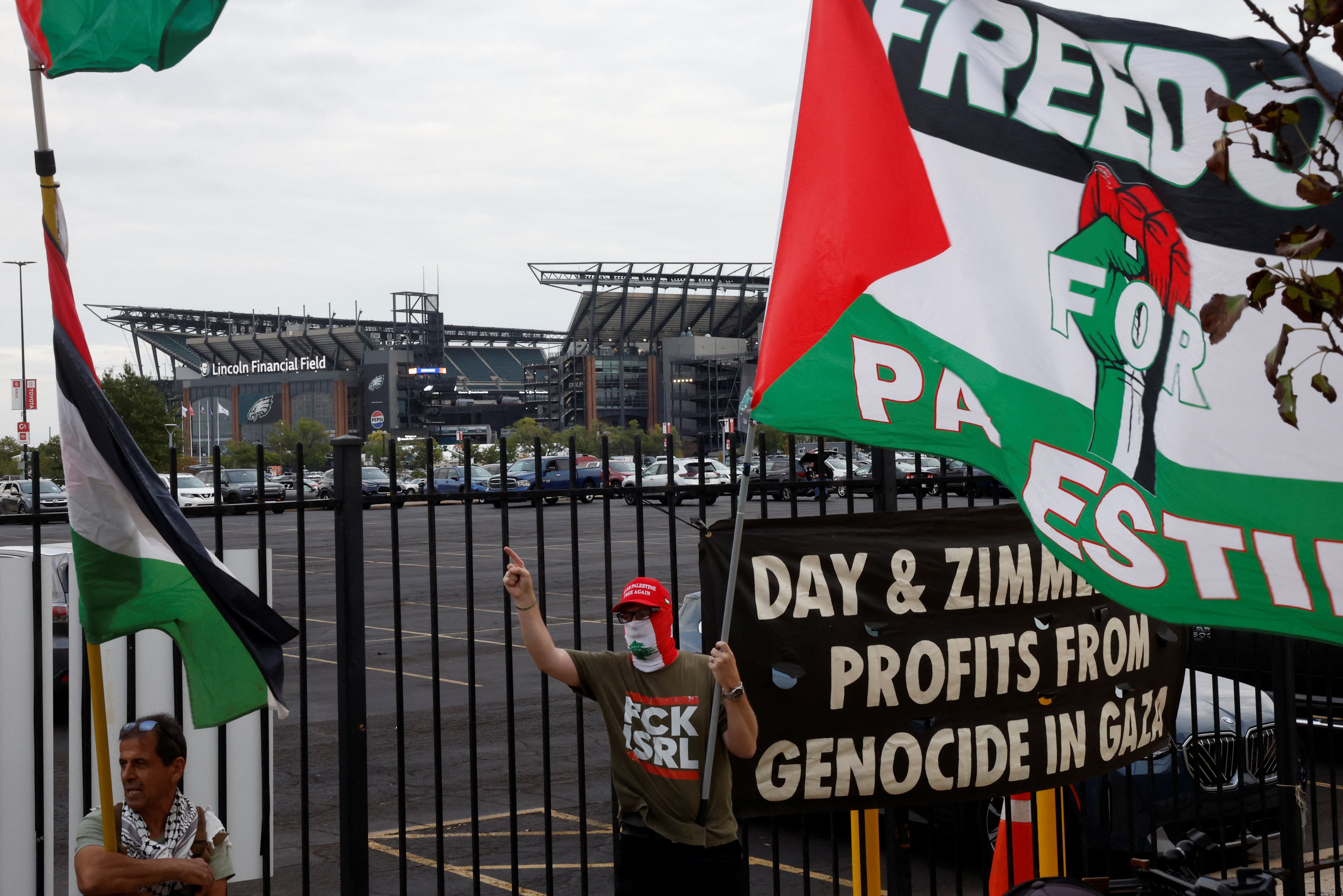 Pro-Palestine protesters gathered outside Sheeran’s first concert without Macklemore last week (Reuters)