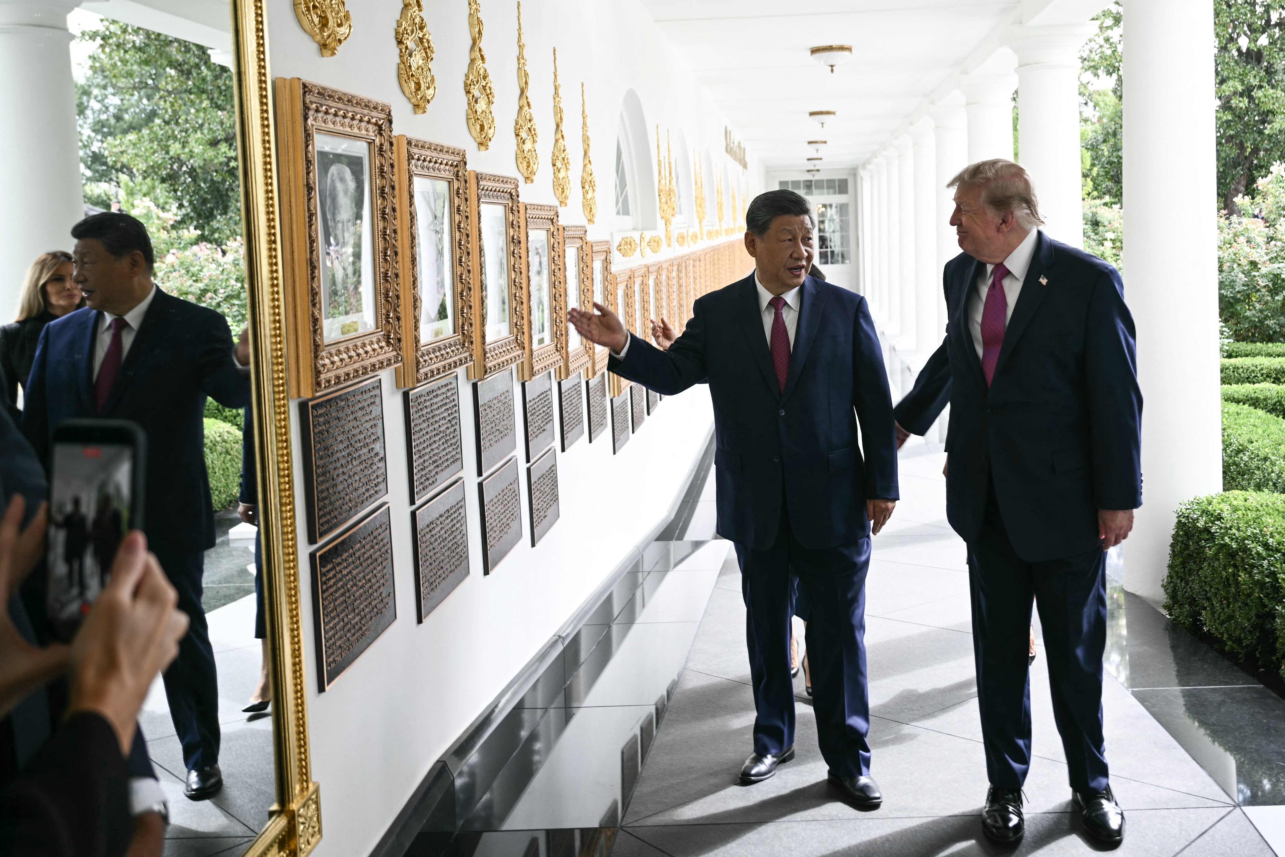 President Donald Trump shows off his ‘Presidential Walk of Fame’ China’s leader Xi Jinping, including a portrait of an autopen that he has standing in for his predecessor Joe Biden on Thursday