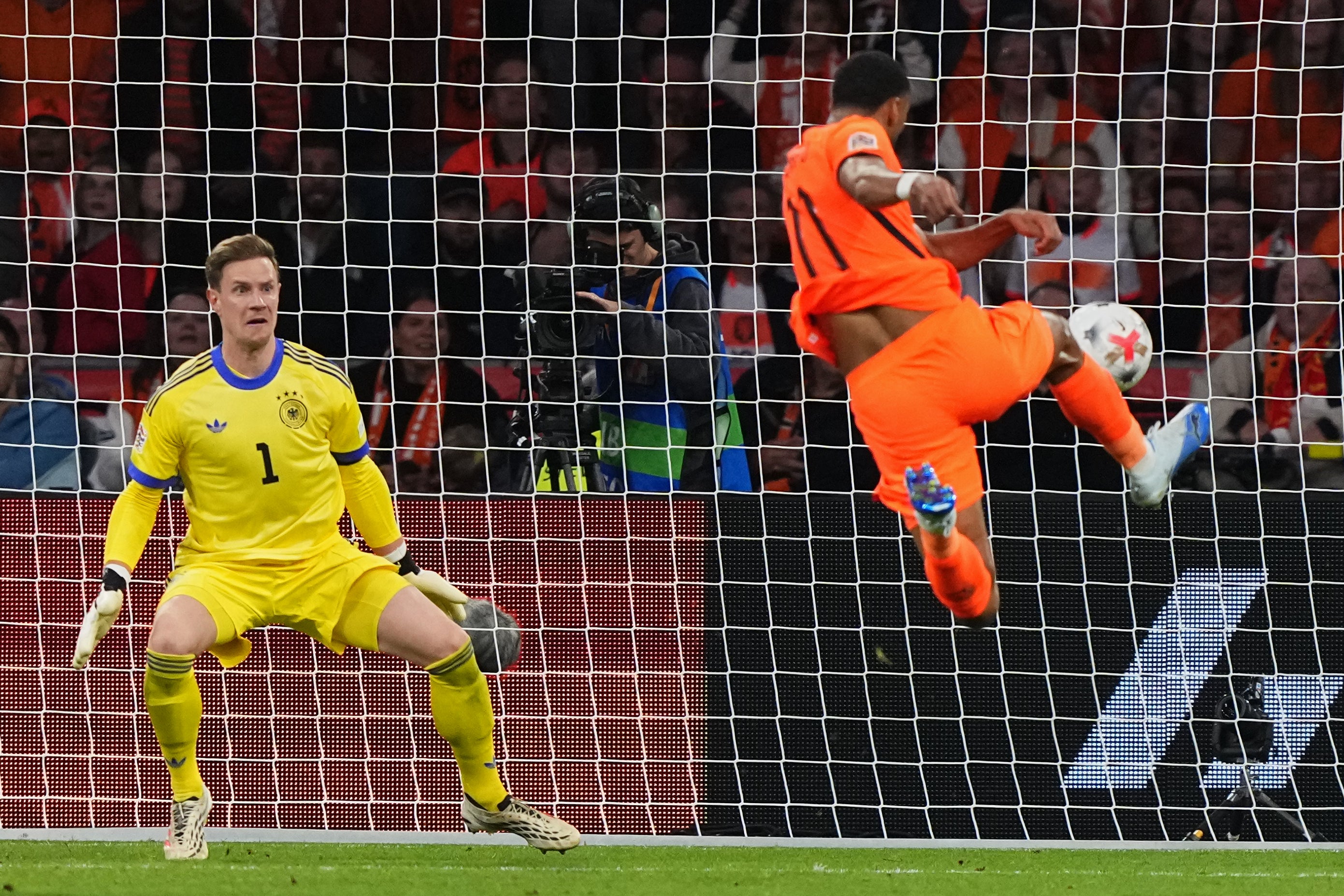 Cody Gakpo’s spectacular volley earned the Netherlands a point late on (AP)