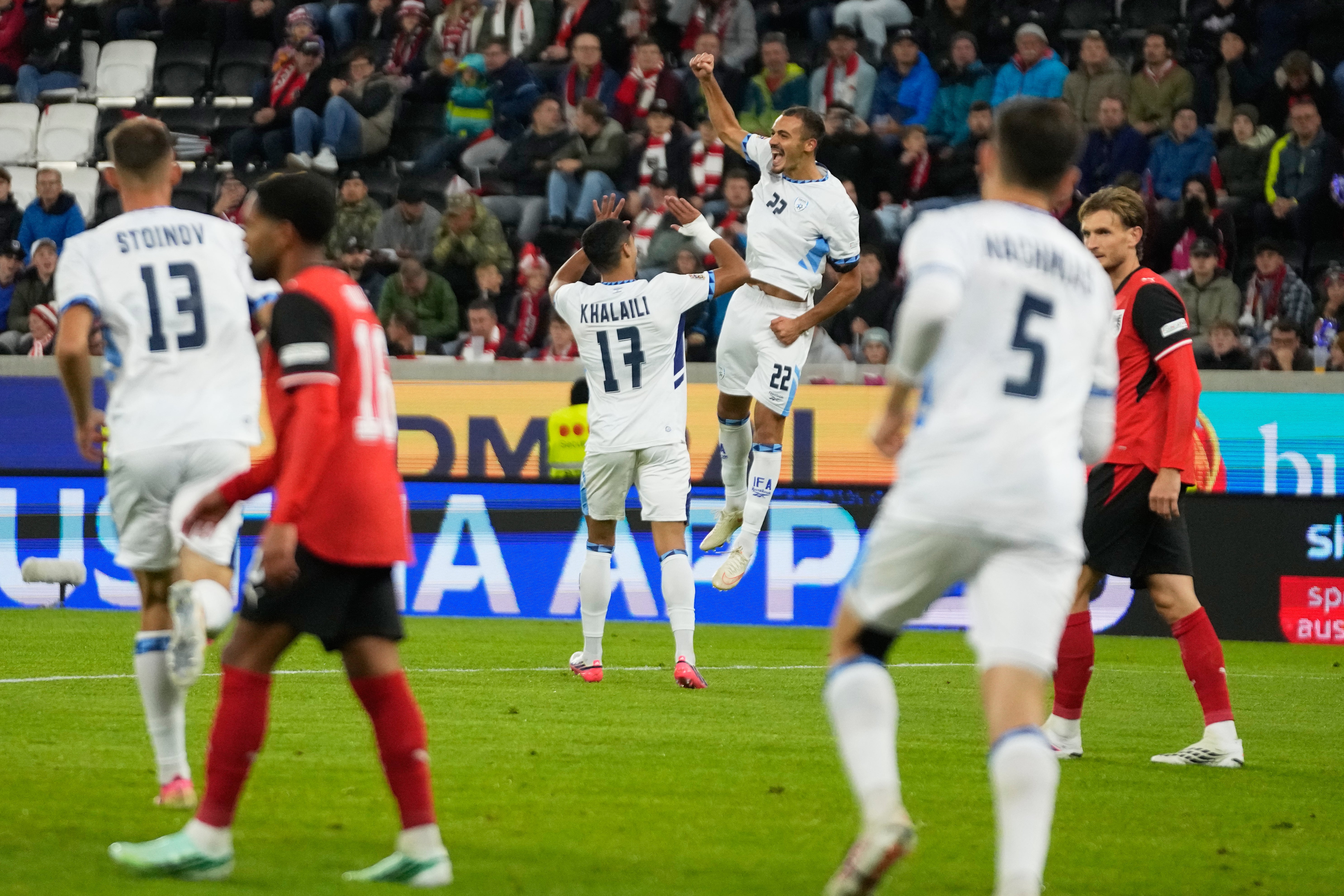 Saied Abu Farchi scored for Israel but was sent off for a gun celebration (AP)